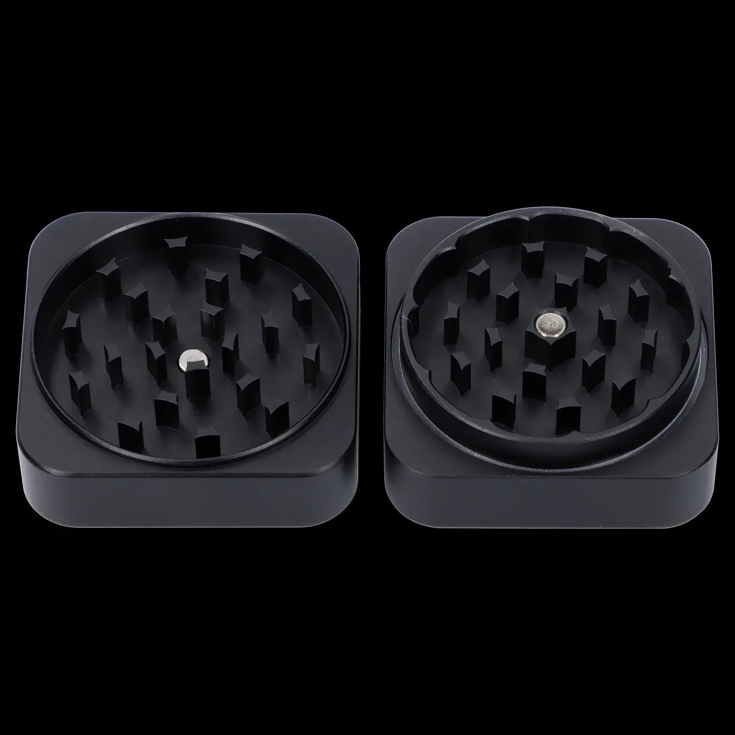 Two black cannabis grinders with visible metal teeth, isolated on a black background.
