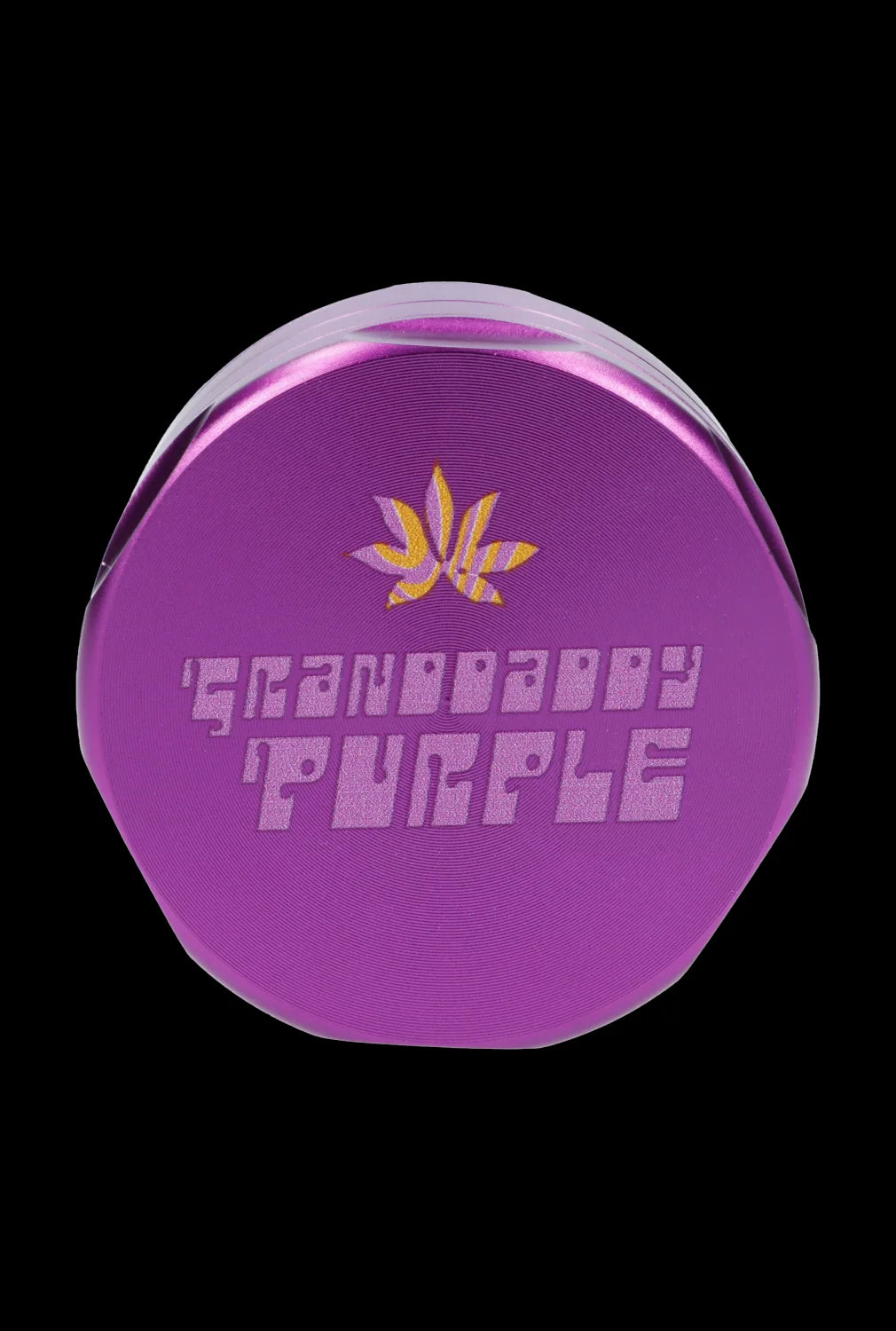 Purple cannabis grinder with a leaf design and “Grandaddy Purple” text. <start_of_image>
