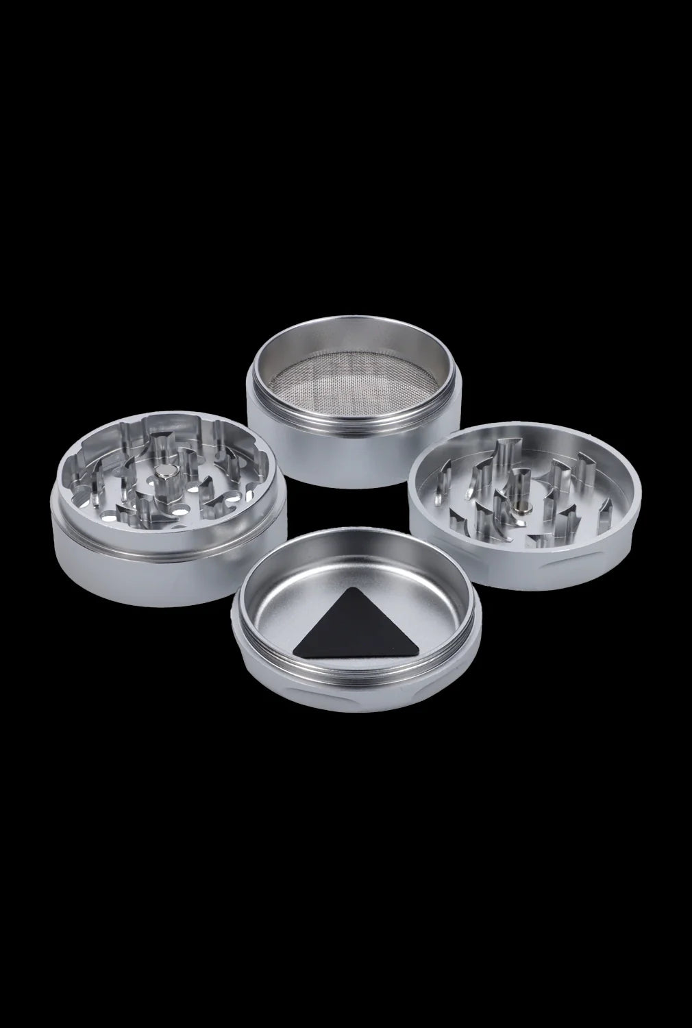 Silver cannabis grinder disassembled into four parts on a black background.