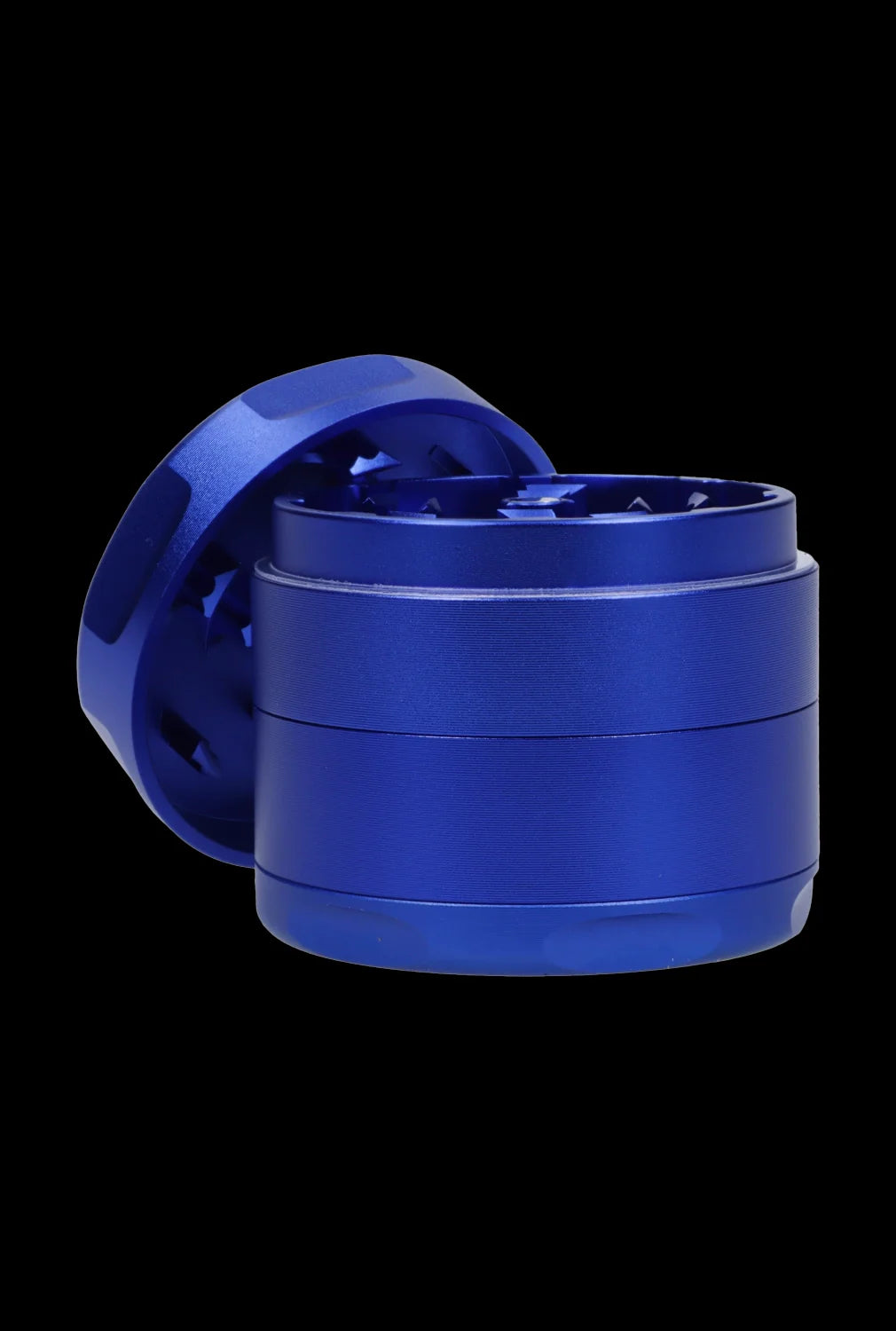Angled close-up of the blue Famous Design-Privilege Aluminum 3 Stage Grinder-Blue against a black background, showing its textured sides and exposed toothed interior.