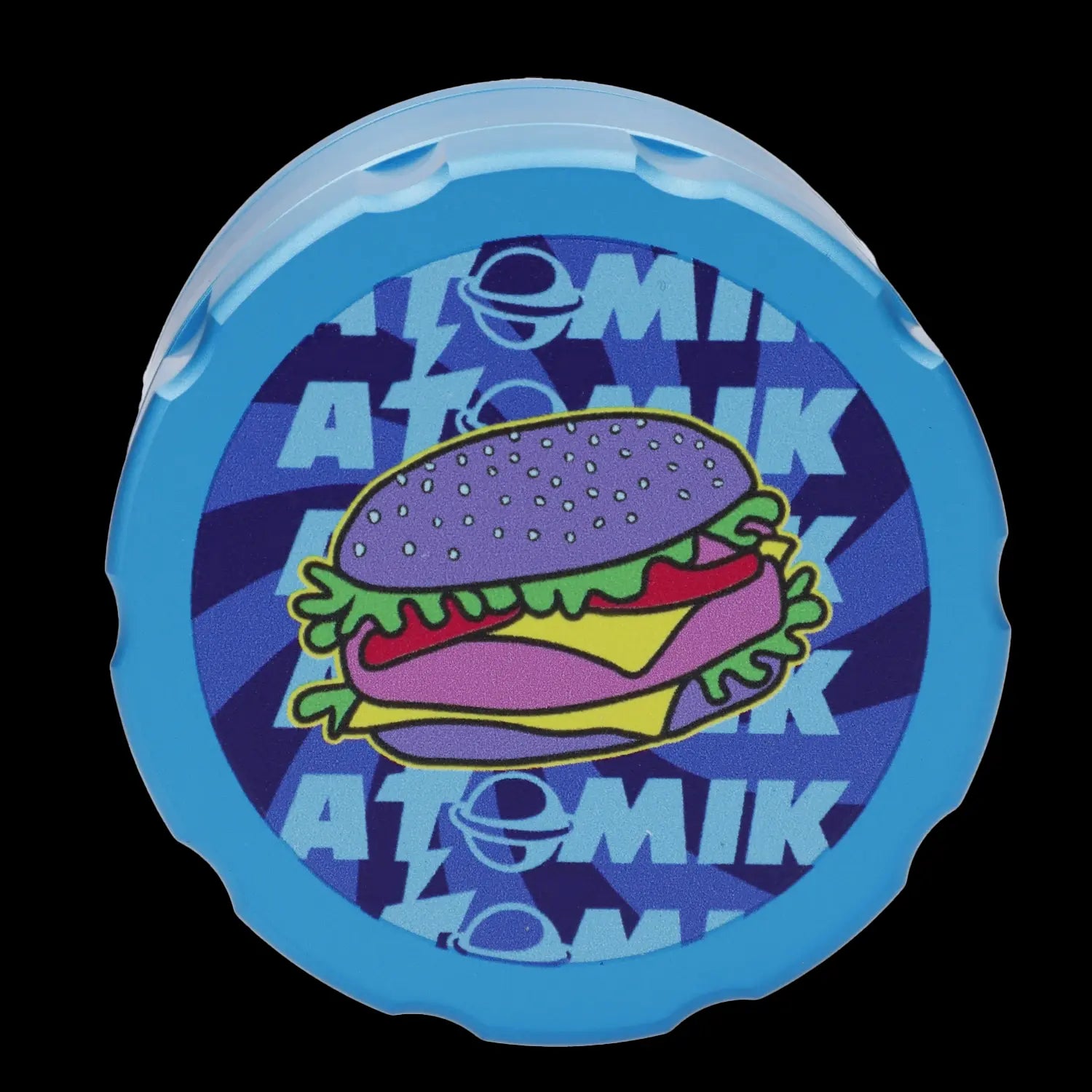 A circular, translucent blue silicone cap with a cartoon hamburger and the text "ATOMIK" repeated around it.