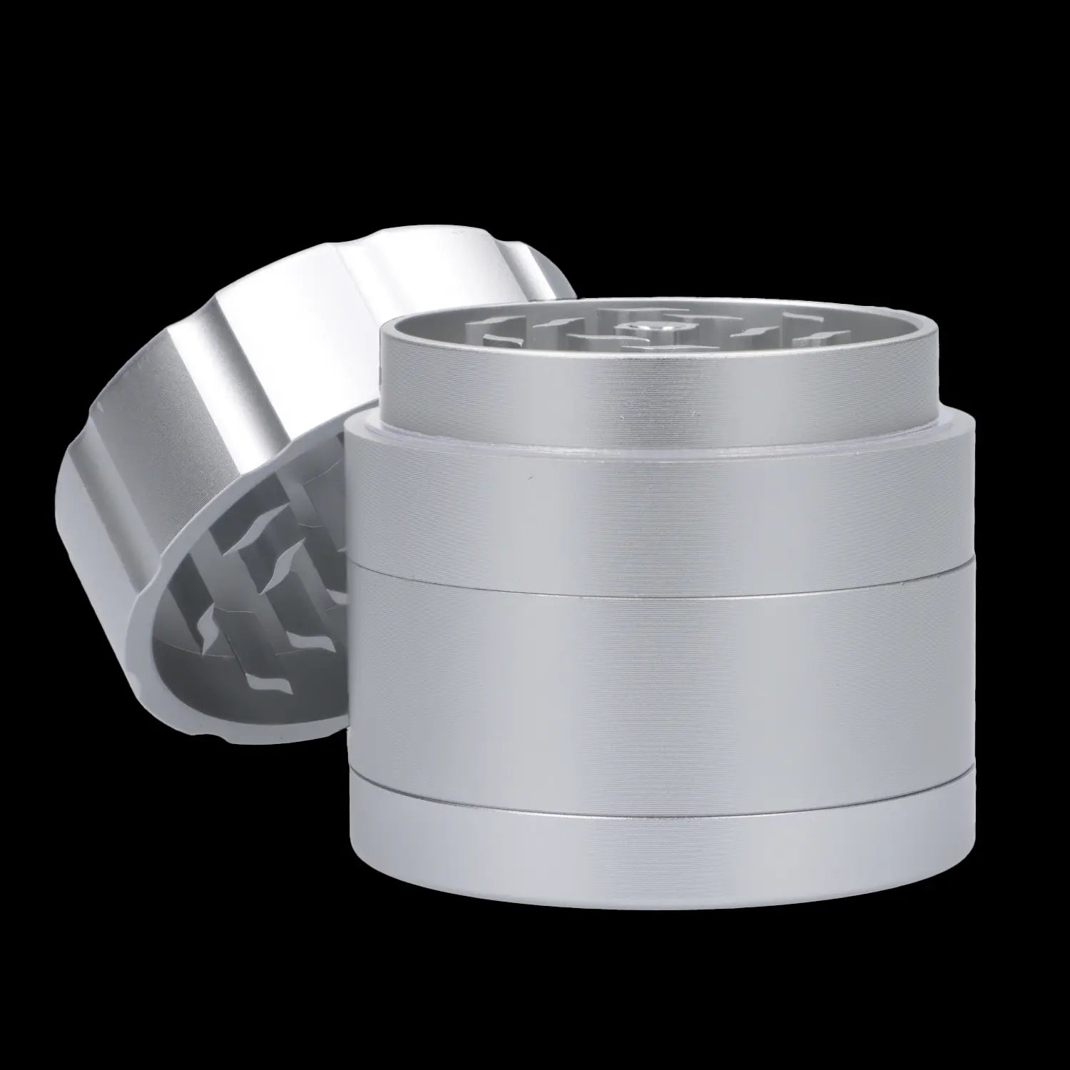 Silver four-piece cannabis grinder with lid partially detached, revealing grinding teeth.