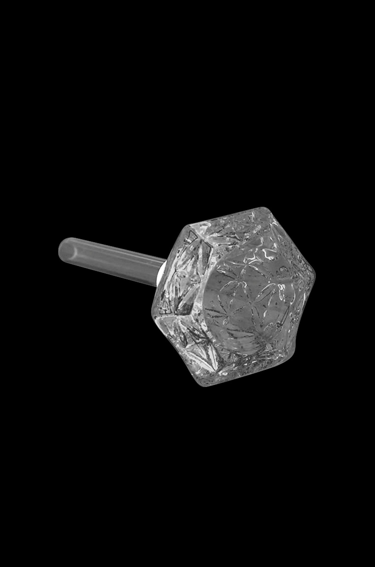 Clear glass cannabis oil burner with faceted, geometric dome.