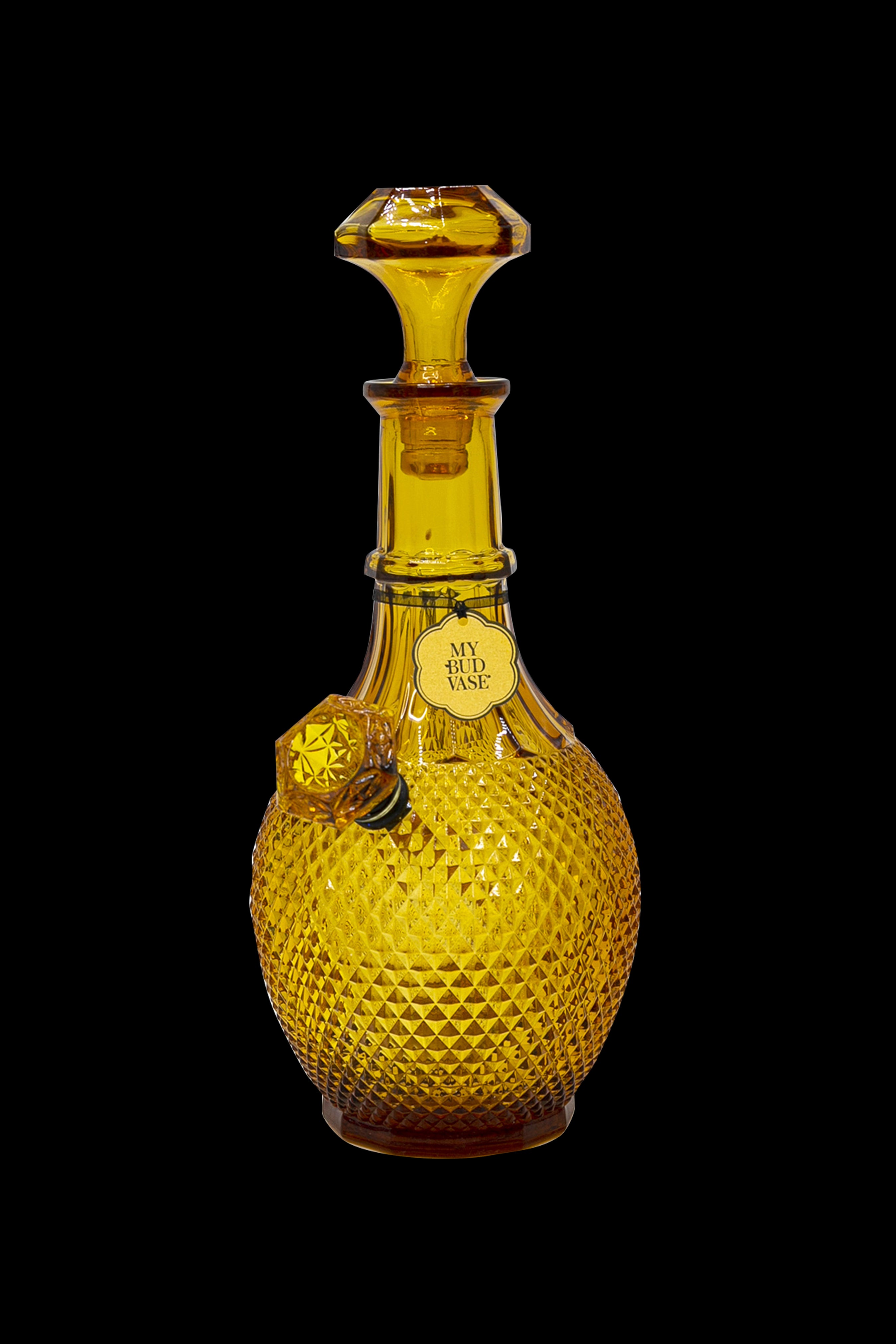 Vintage amber glass cannabis water pipe with a textured, diamond-patterned body and a decorative label reading "My Bud Vase."