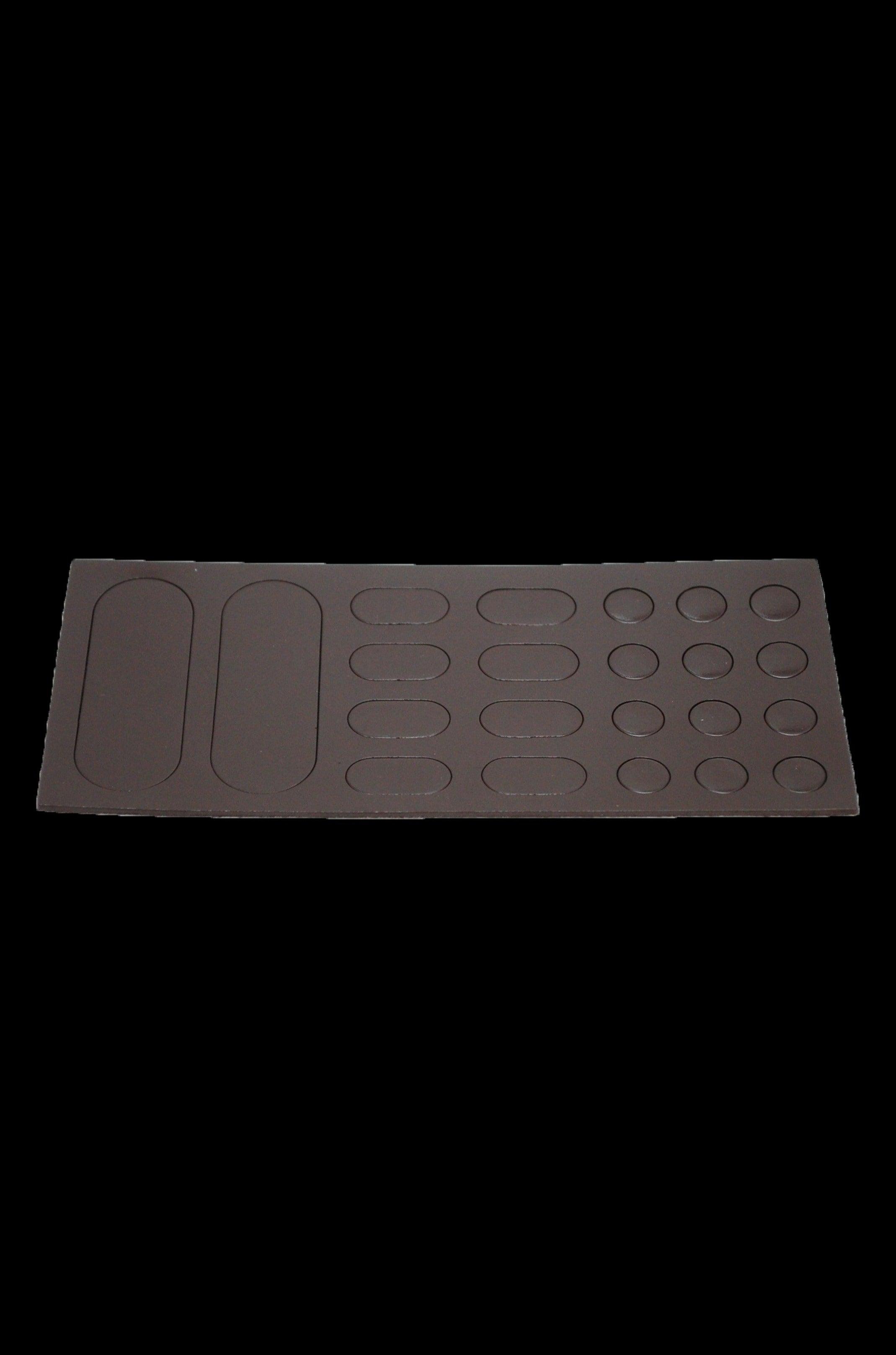 Silicone dab station mat with multiple sized circular and rectangular wells for concentrates and tools.