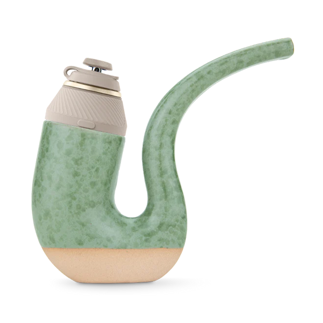 Side view of the Matcha-colored Puffco Proxy Terrapipe with a speckled green curved body, beige base, and a tilted beige mouthpiece.