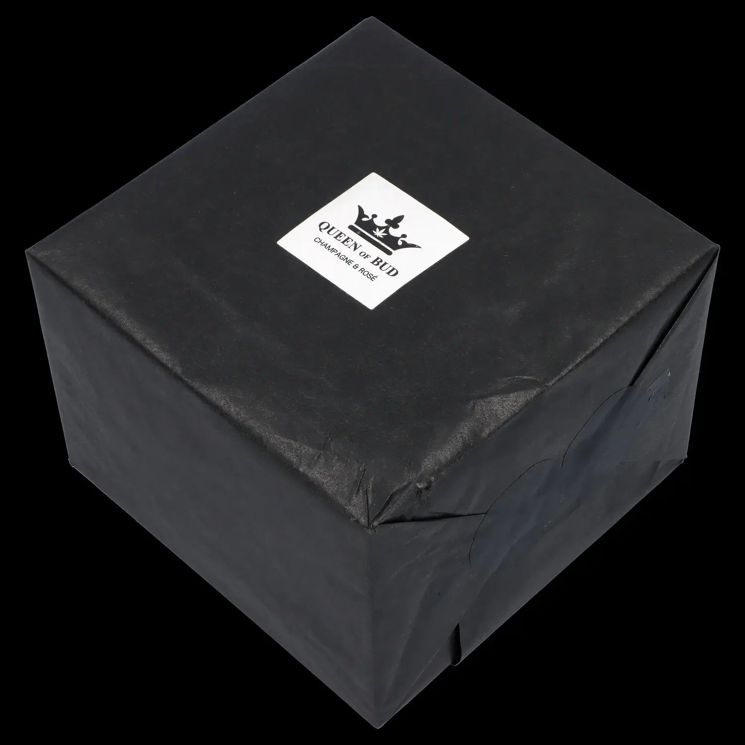Black gift box with “Queen of Bud” branding, likely containing cannabis accessories.