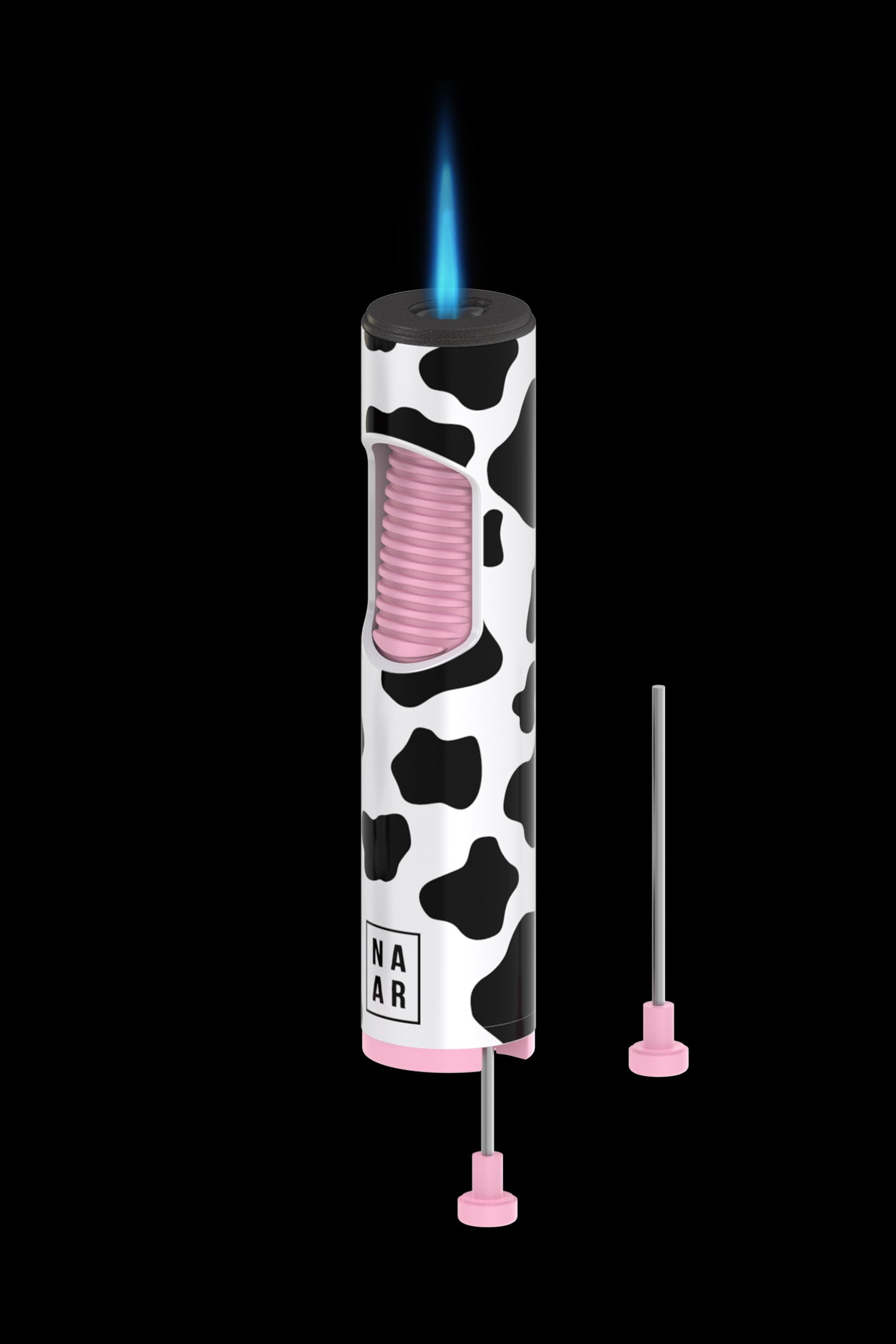 Cow-print butane torch lighter with two slim dabbing tools beside it, against a black background.