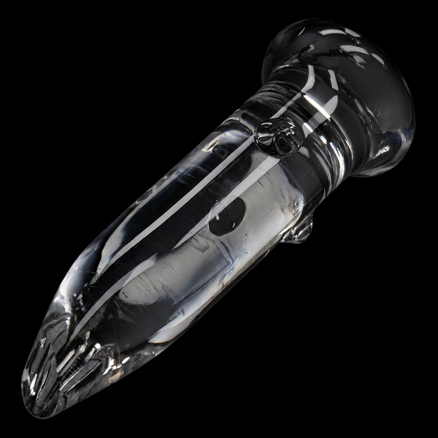 Angled close-up of the clear Smoke Cartel Glass Nail 18mm showcasing its smooth, reflective surface and rounded mouthpiece against a black background