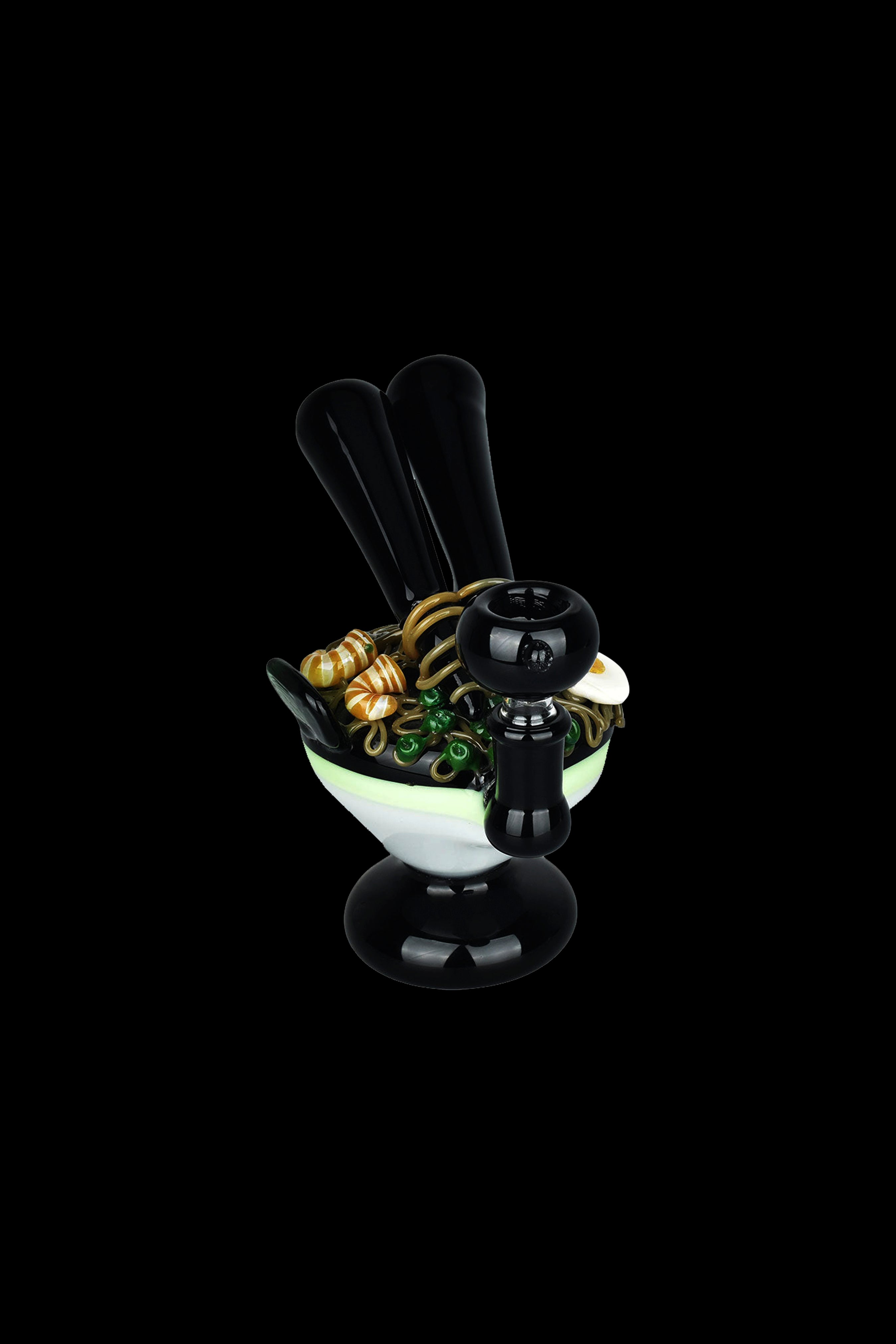 A black glass water pipe filled with green and yellow cannabis buds, set against a black background.