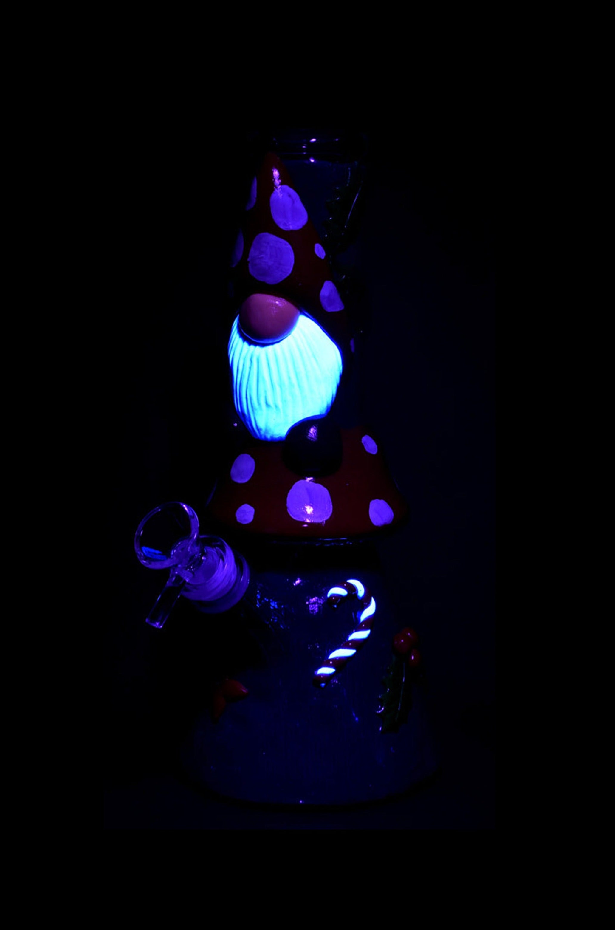 Glowing blue and purple glass cannabis water pipe against a black background.