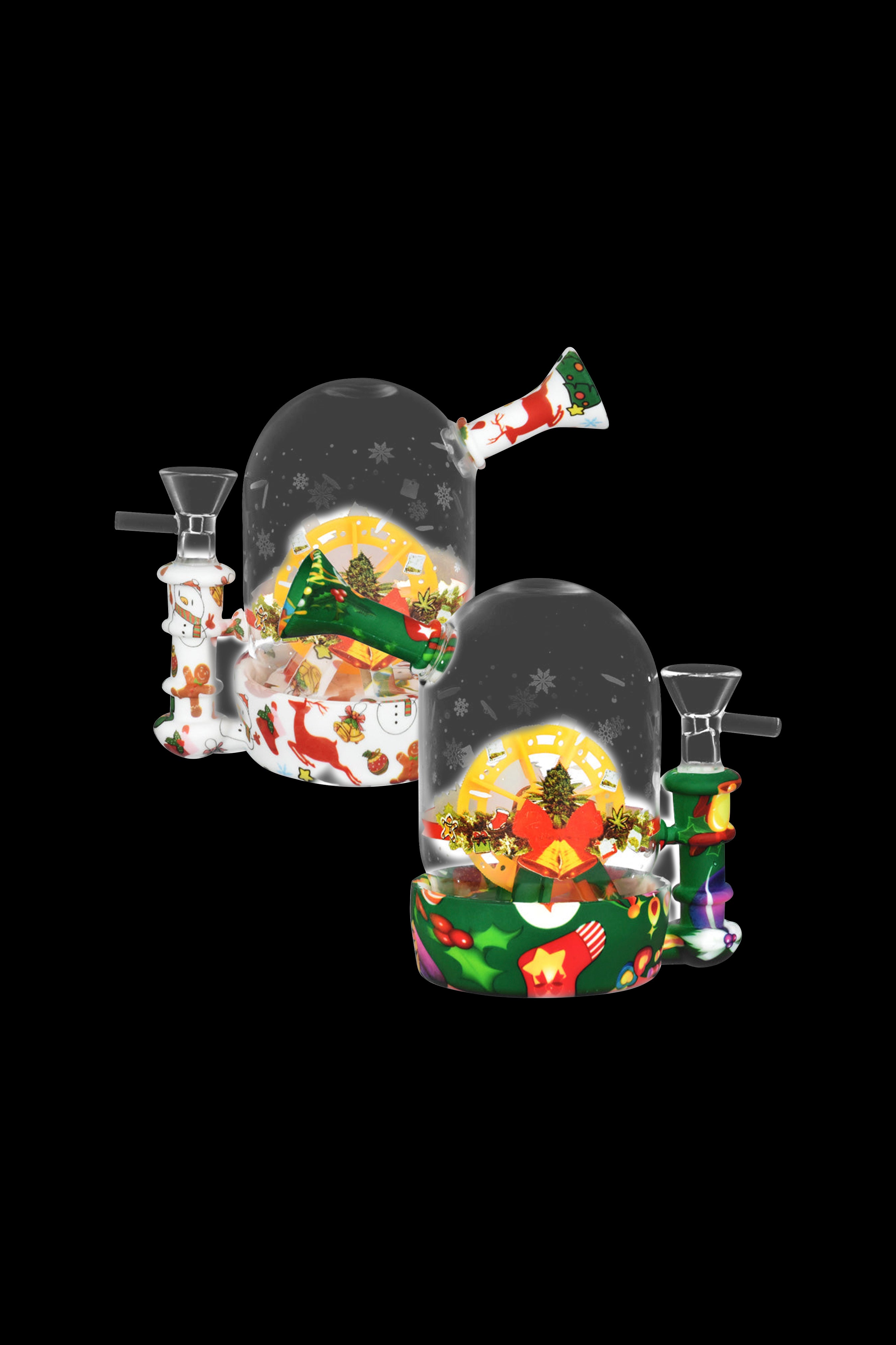 Holiday-themed cannabis water pipes resembling snow globes with festive winter scenes.