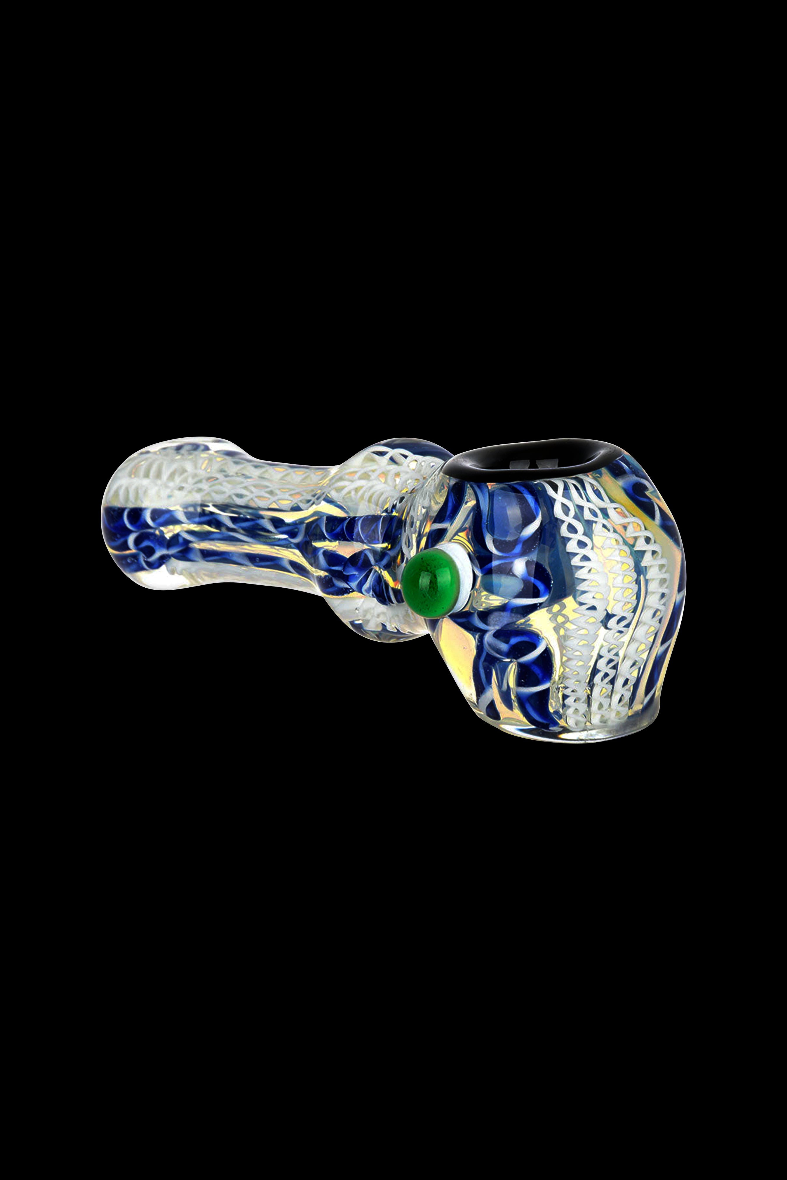 Blue and white glass pipe with green cannabis bud.
