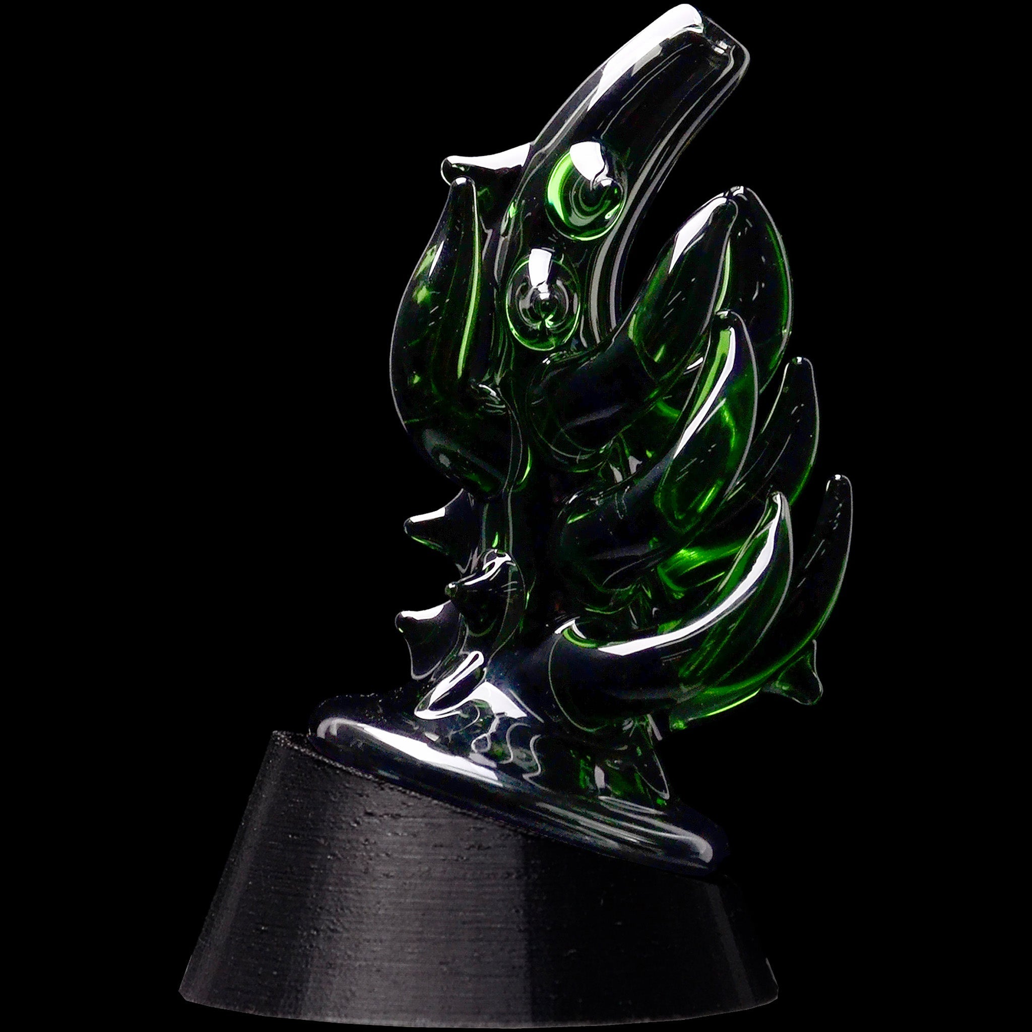 Close-up three-quarter view of the Glassic Cosmic Tentacle Puffco Peak Glass Attachment showing glossy dark green glass tentacles against a black background