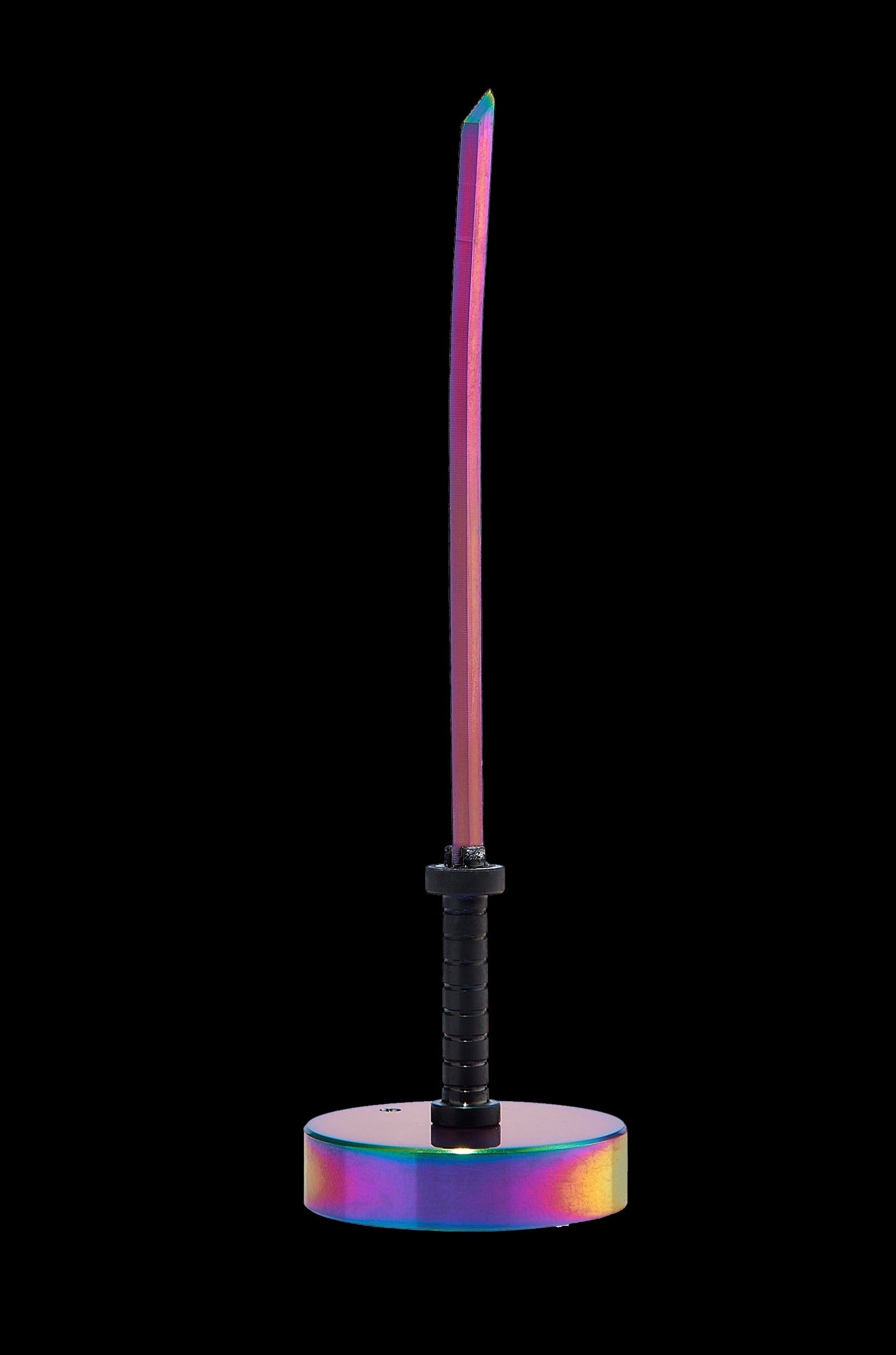Iridescent cannabis oil burner resembling a katana sword on a matching base, against a black background.