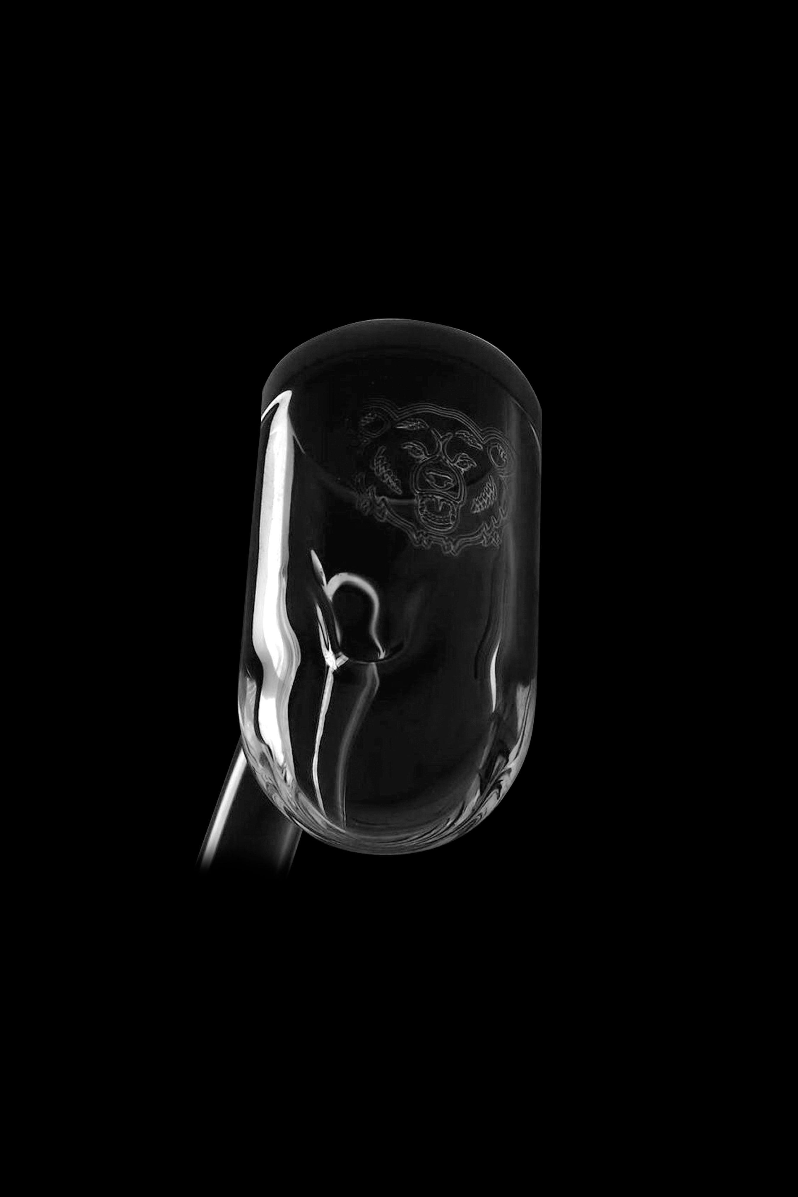 Elegant glass cannabis water pipe against a black background.