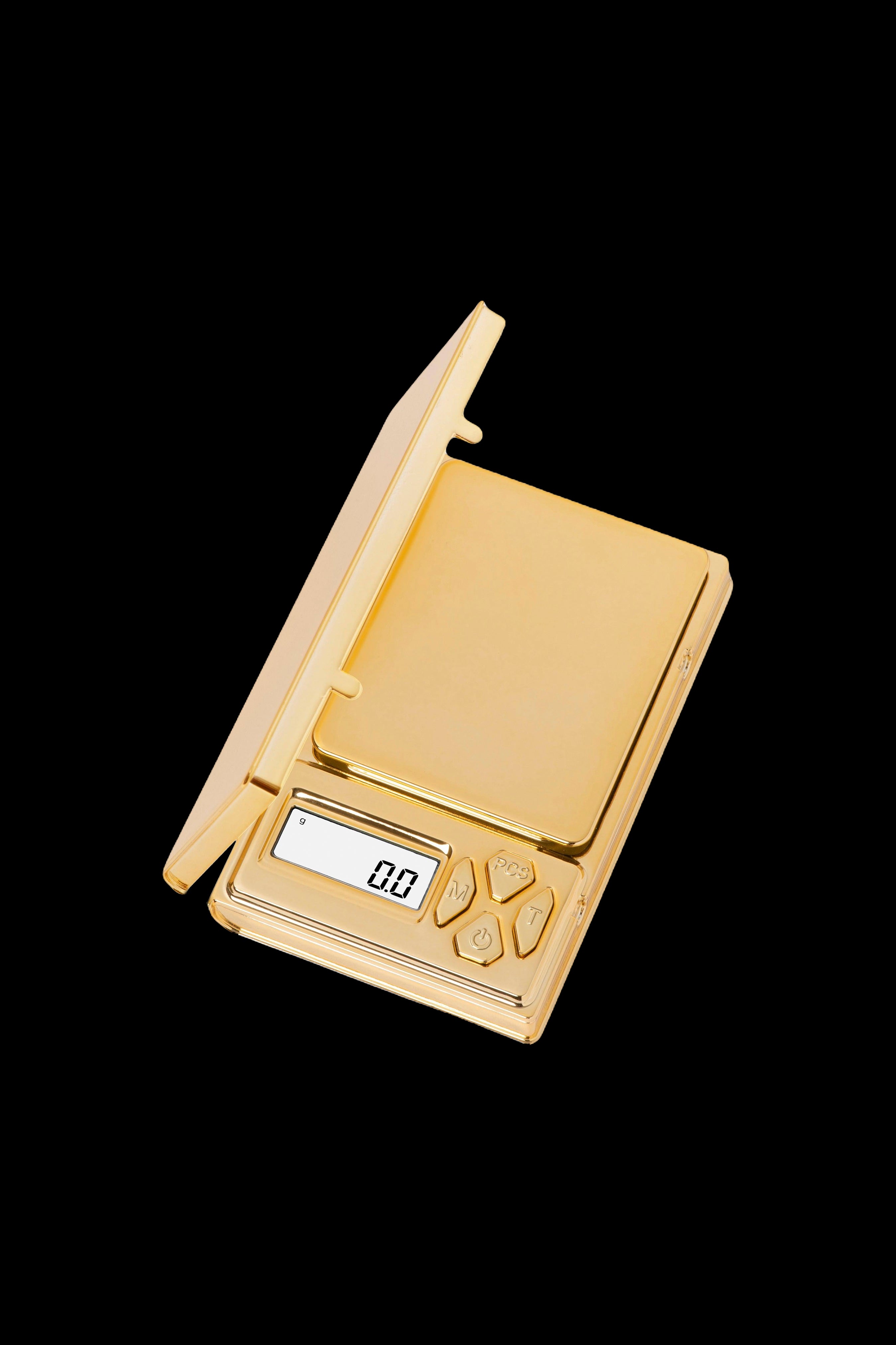 Gold digital scale for measuring cannabis.