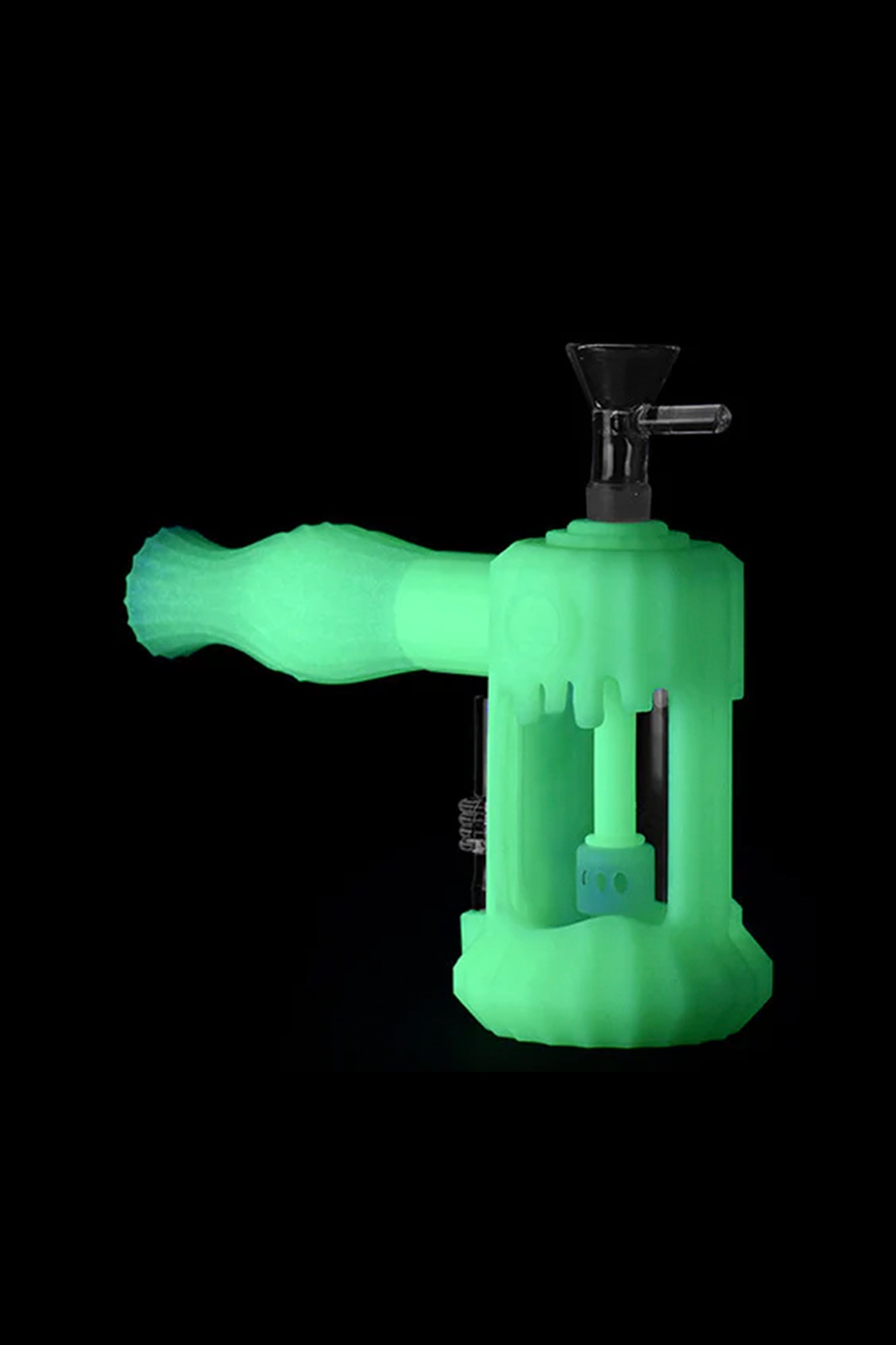 Glowing green silicone bubbler water pipe for cannabis use.