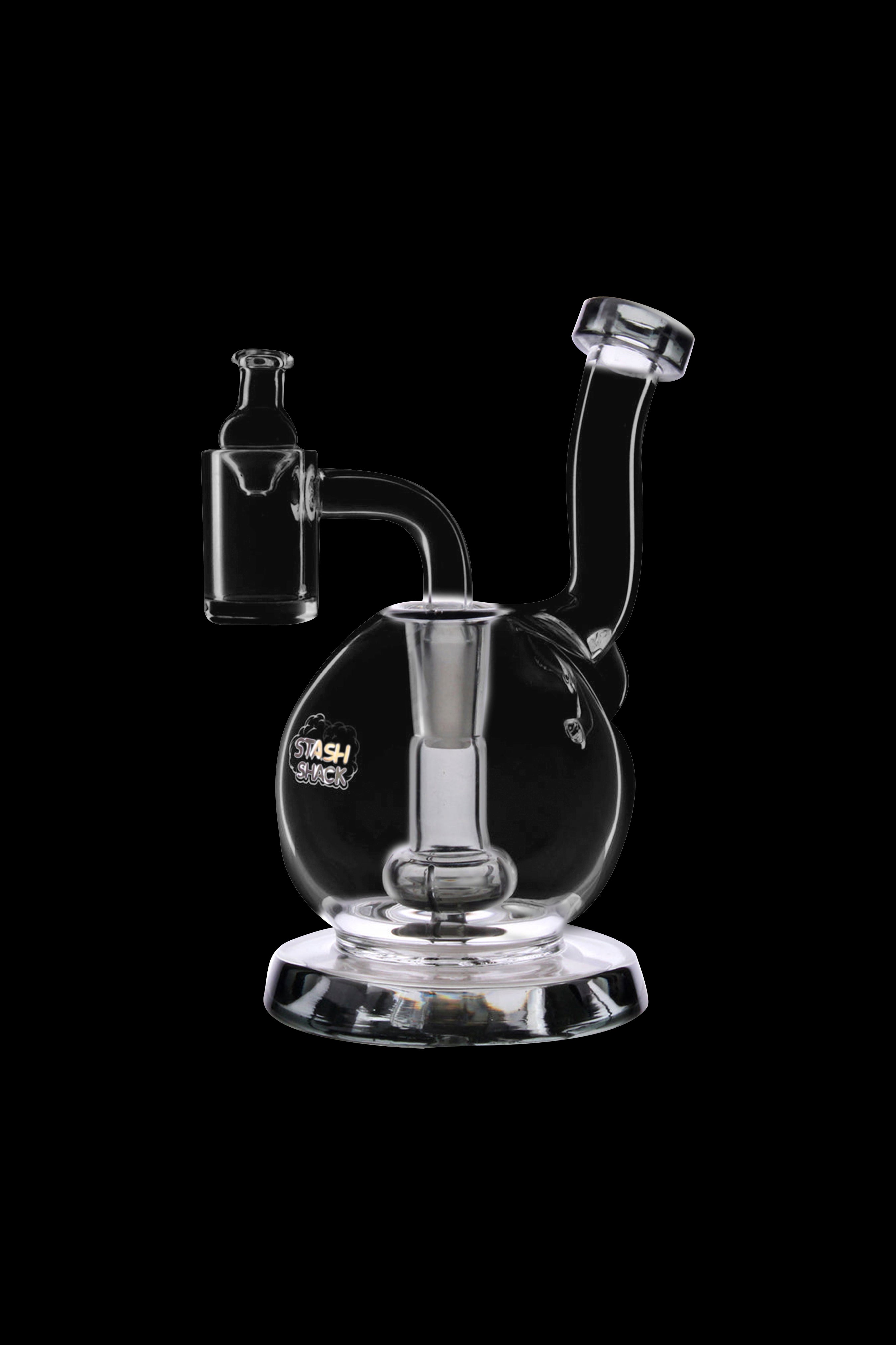Clear glass dab rig with a bubbler and quartz nail, isolated on a black background.