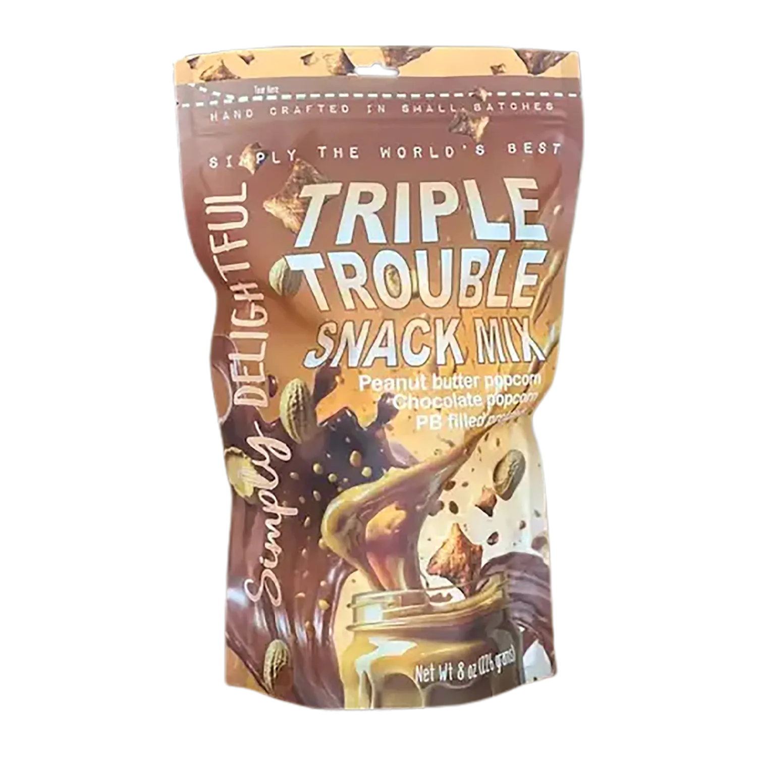 Front-facing shot of the Simply Delightful Triple Trouble Snack Mix pouch with swirling peanut butter and chocolate graphics.