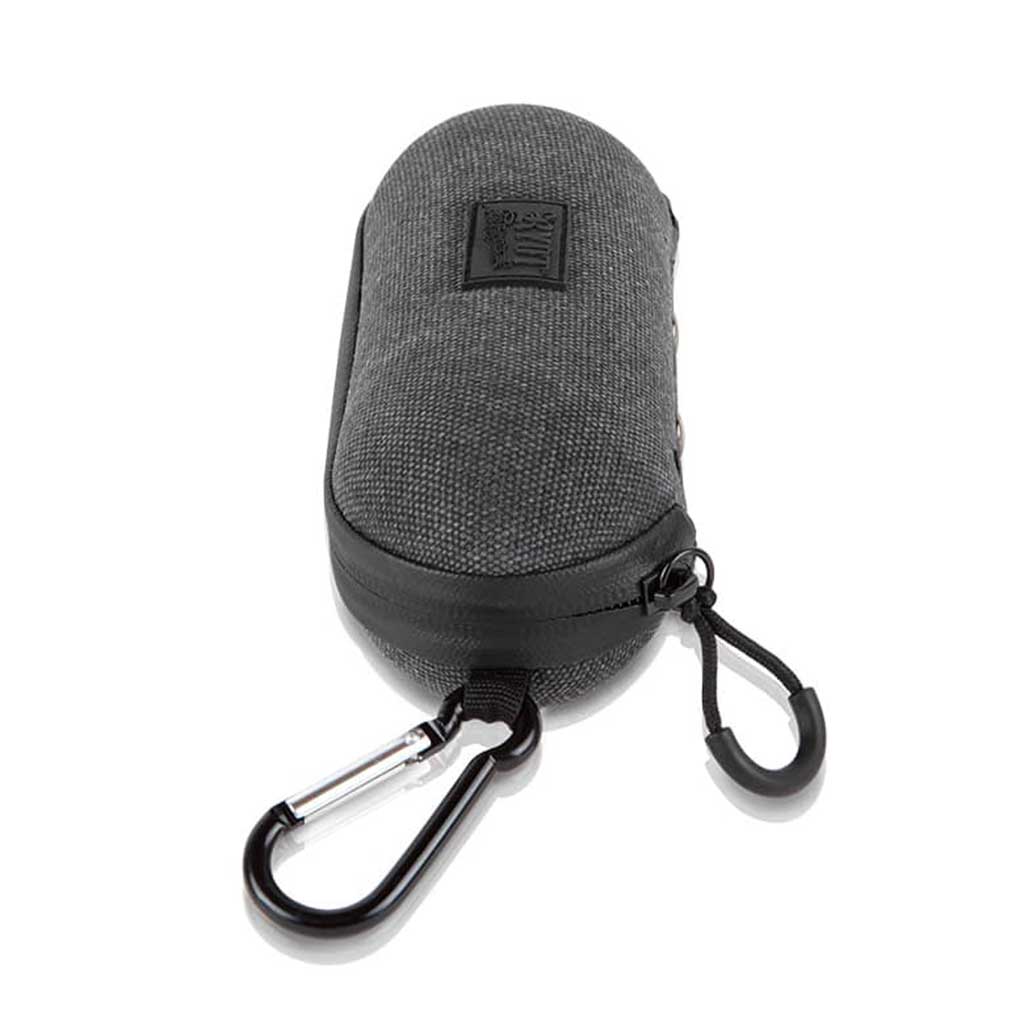 Angled close-up of a dark gray RYOT Hardcase with textured fabric, visible zipper, carabiner clip, and looped cord on a white background.