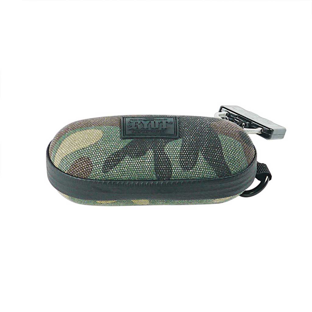 Low-angle front view of a camo fabric RYOT Hardcase with rounded shell, black zipper trim, logo patch, and attached metal clip.