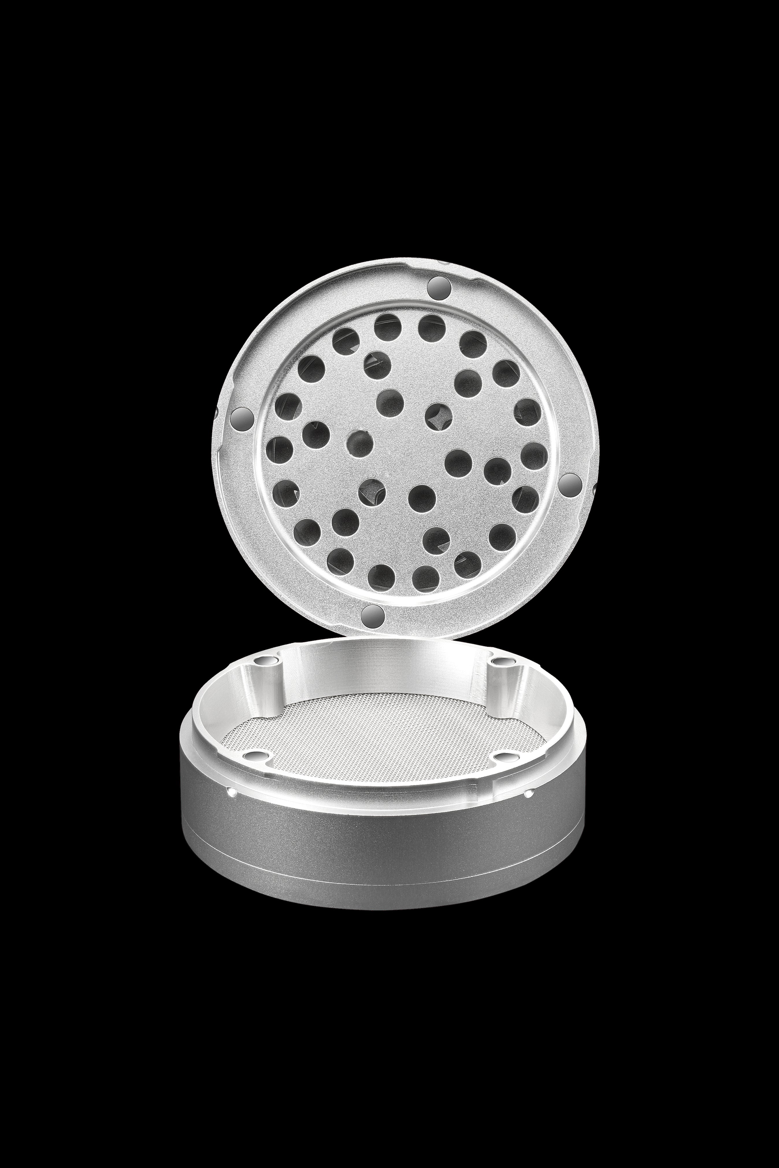 Silver cannabis grinder with open lid revealing a grated interior.