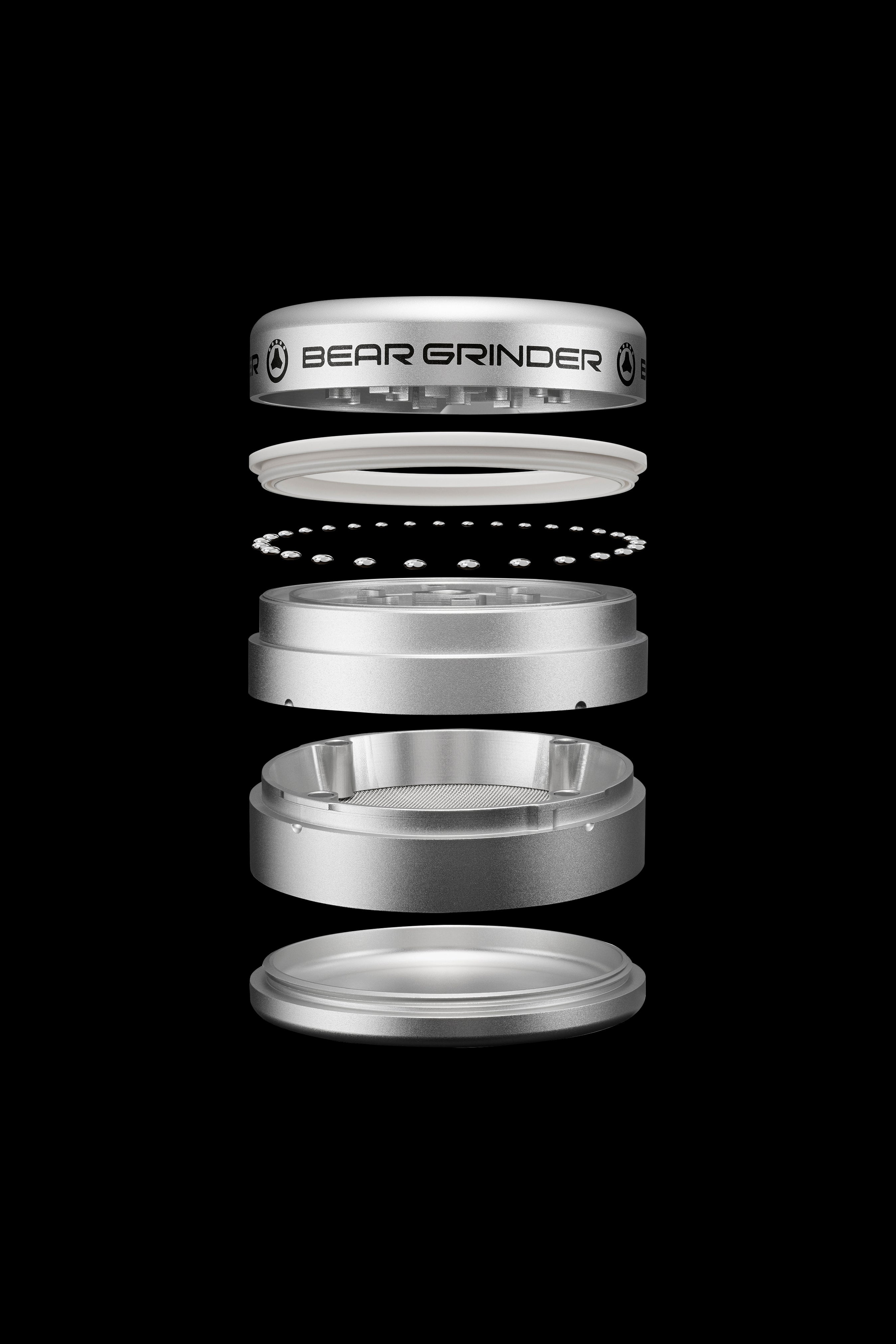Exploded view of a silver cannabis grinder labeled "BEAR GRINDER", showcasing its disassembled components.