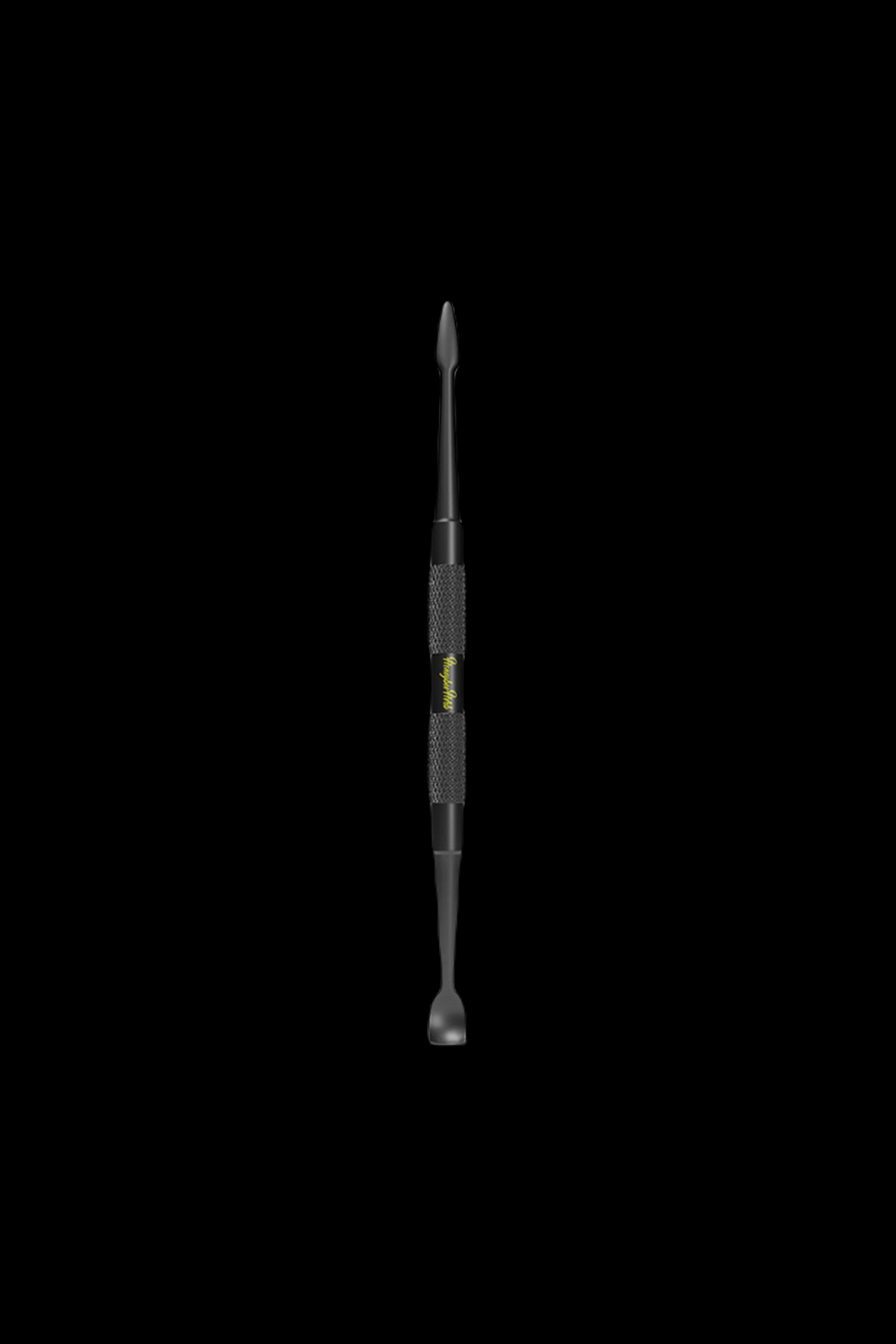Black dab tool with textured grip, isolated on a black background.