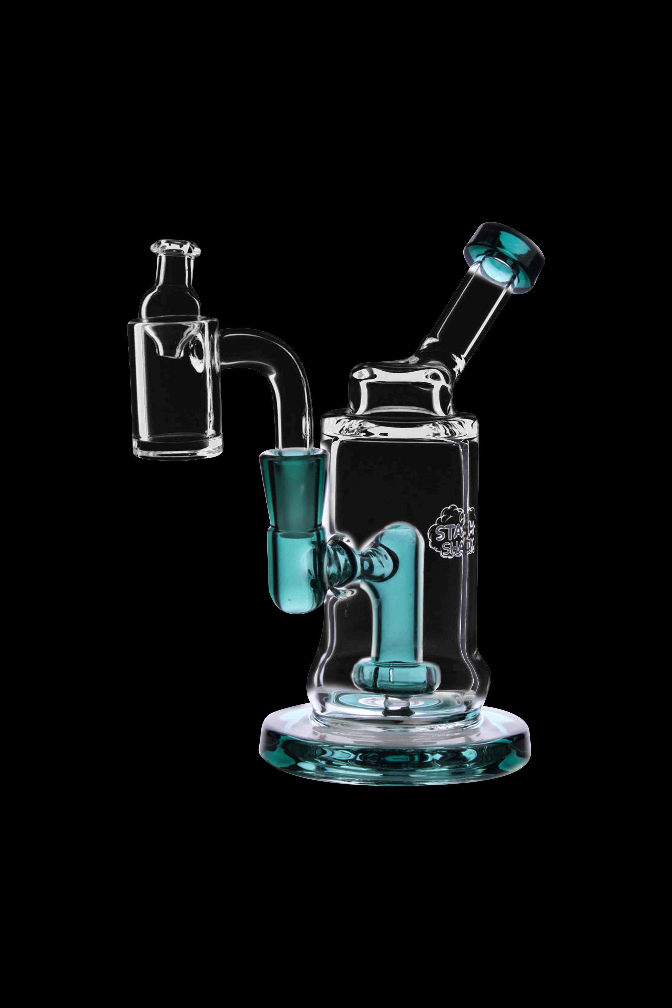 Clear glass dab rig with teal accents and accessories, studio shot on black background.