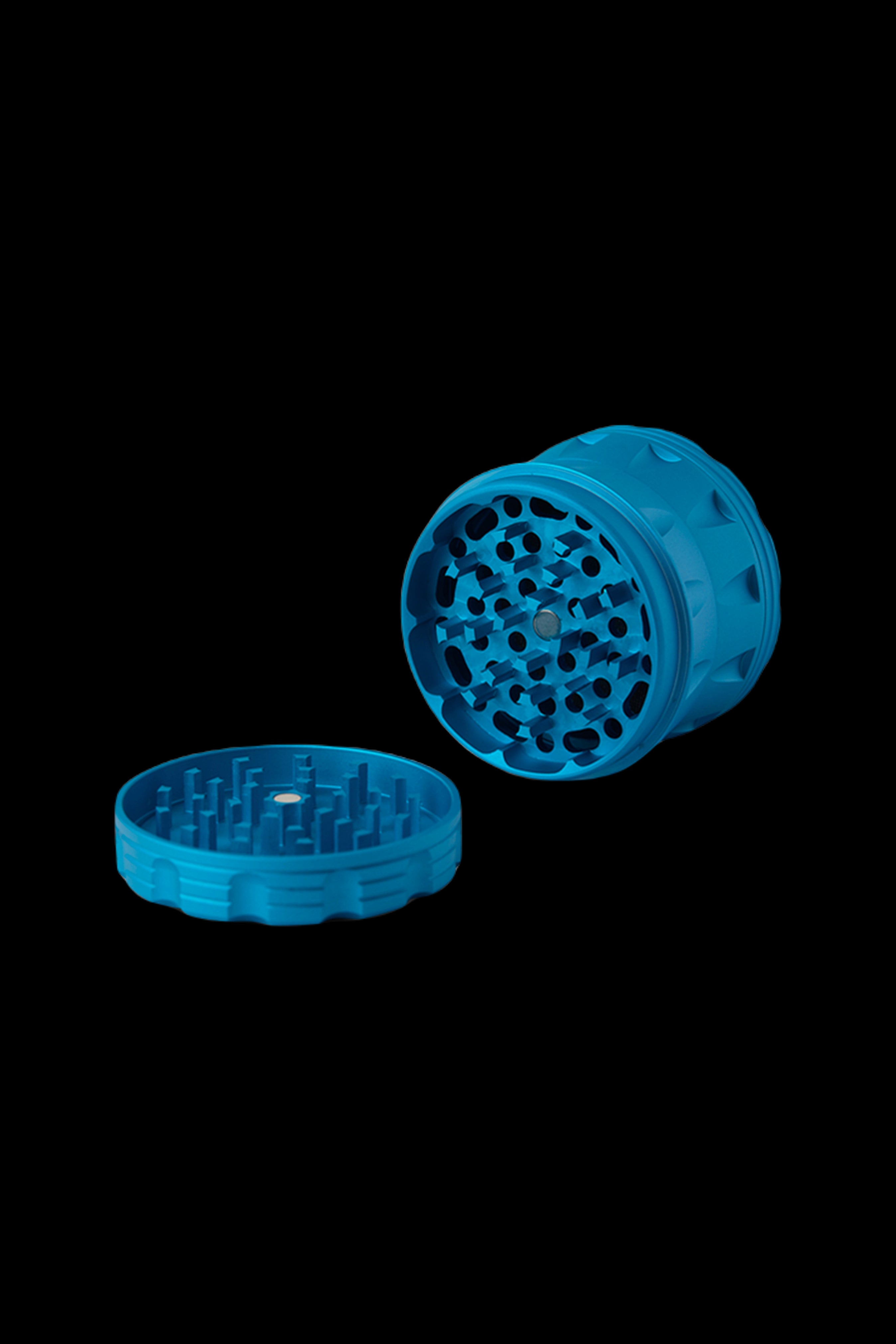 Blue cannabis grinder with open lid, displaying internal grinding mechanism.