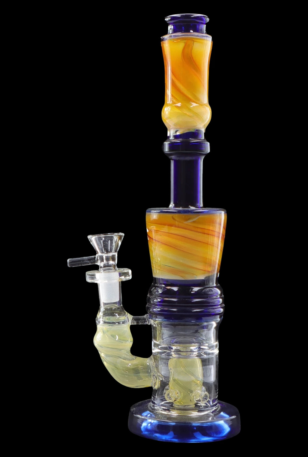 A vibrant glass water pipe (bong) with swirling orange and yellow accents against a dark background.