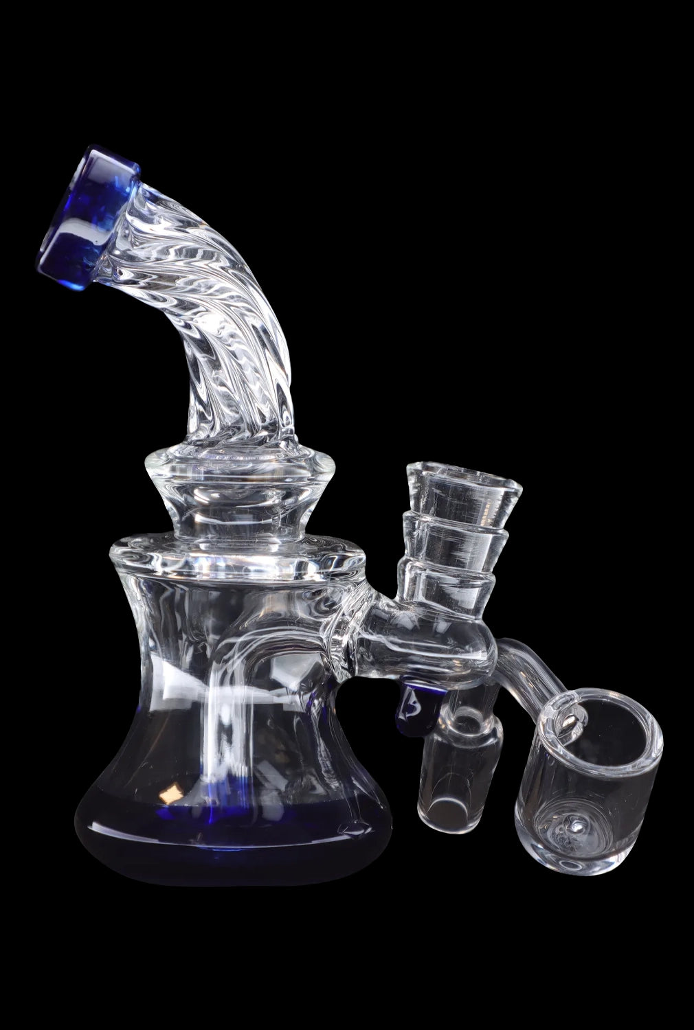 Clear glass rig with attachments, used for concentrated cannabis consumption.