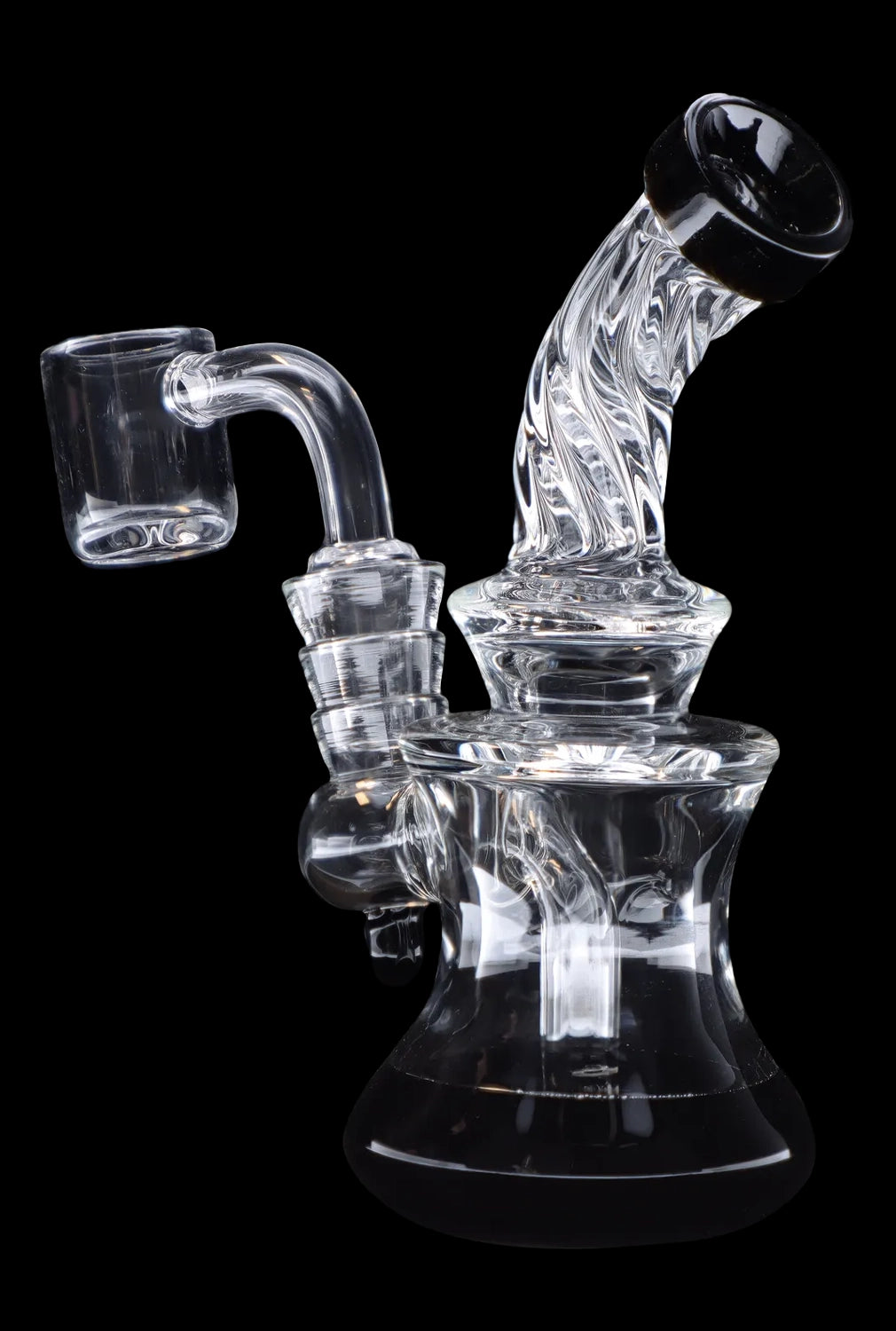 Clear glass dab rig with quartz banger, isolated on black.