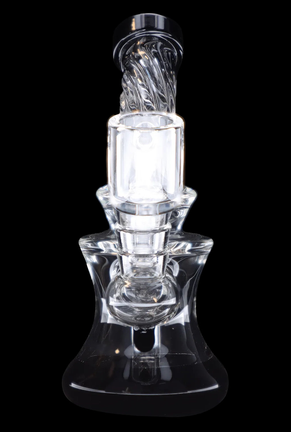 Clear glass dab rig with intricate swirling design, isolated on a black background.