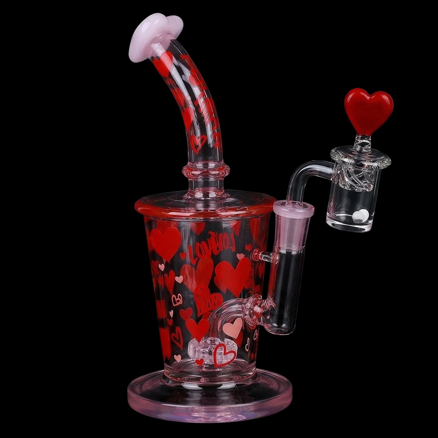 Angled close-up of the Pulsar Valentine's Love Hearts Glass Dab Rig Set - 8.5" / 14mm F, showing red heart decals, a curved mouthpiece and heart-topped banger against a black background.