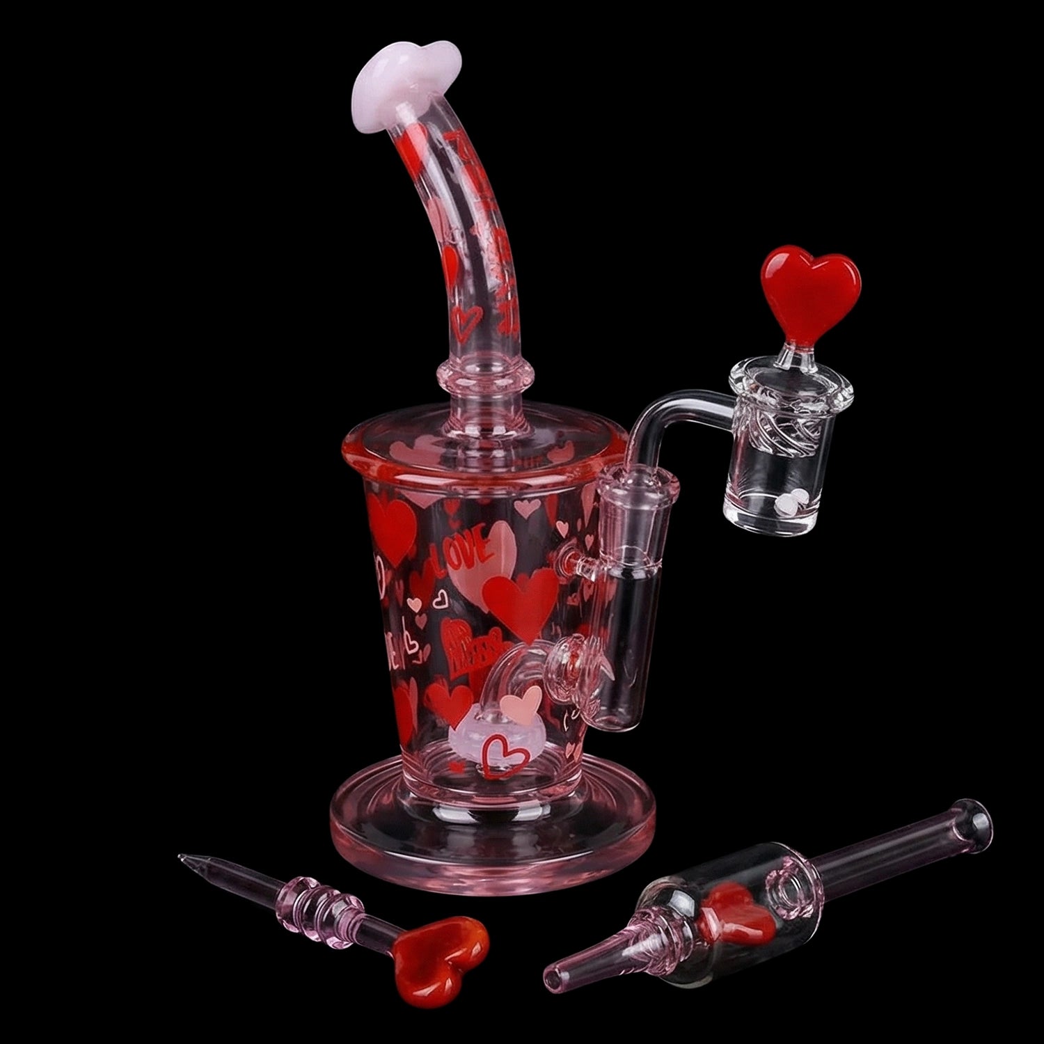 Angled close-up of the Pulsar Valentine's Love Hearts Glass Dab Rig Set - 8.5" / 14mm F showing pink glass with red heart motifs and a heart-topped banger against a black background