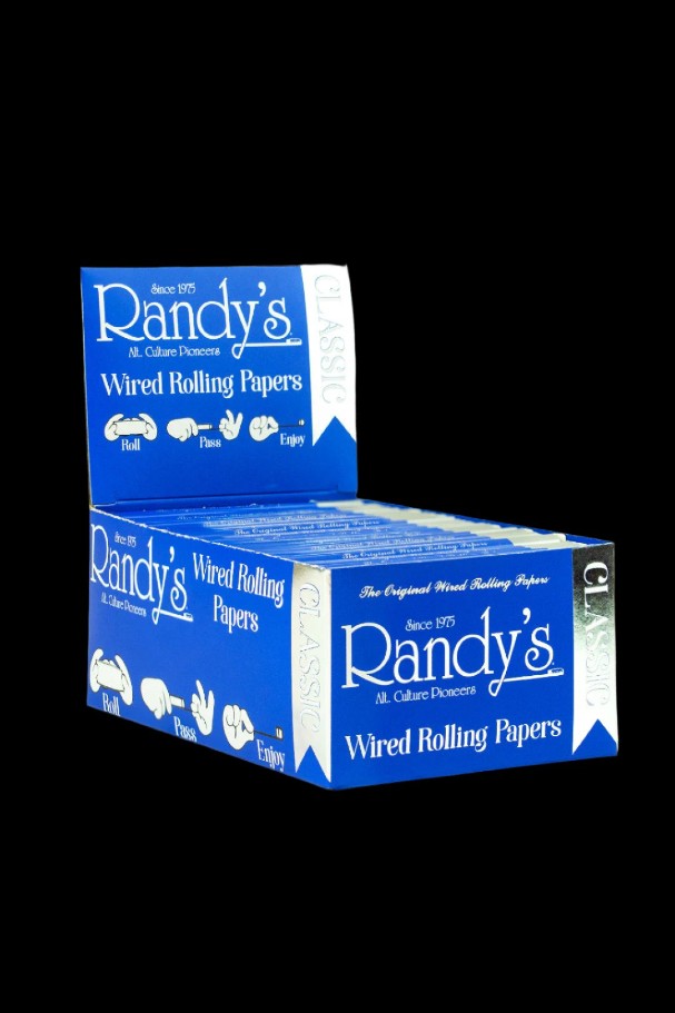 Stacked boxes of Randy's Wired Rolling Papers on a dark background.