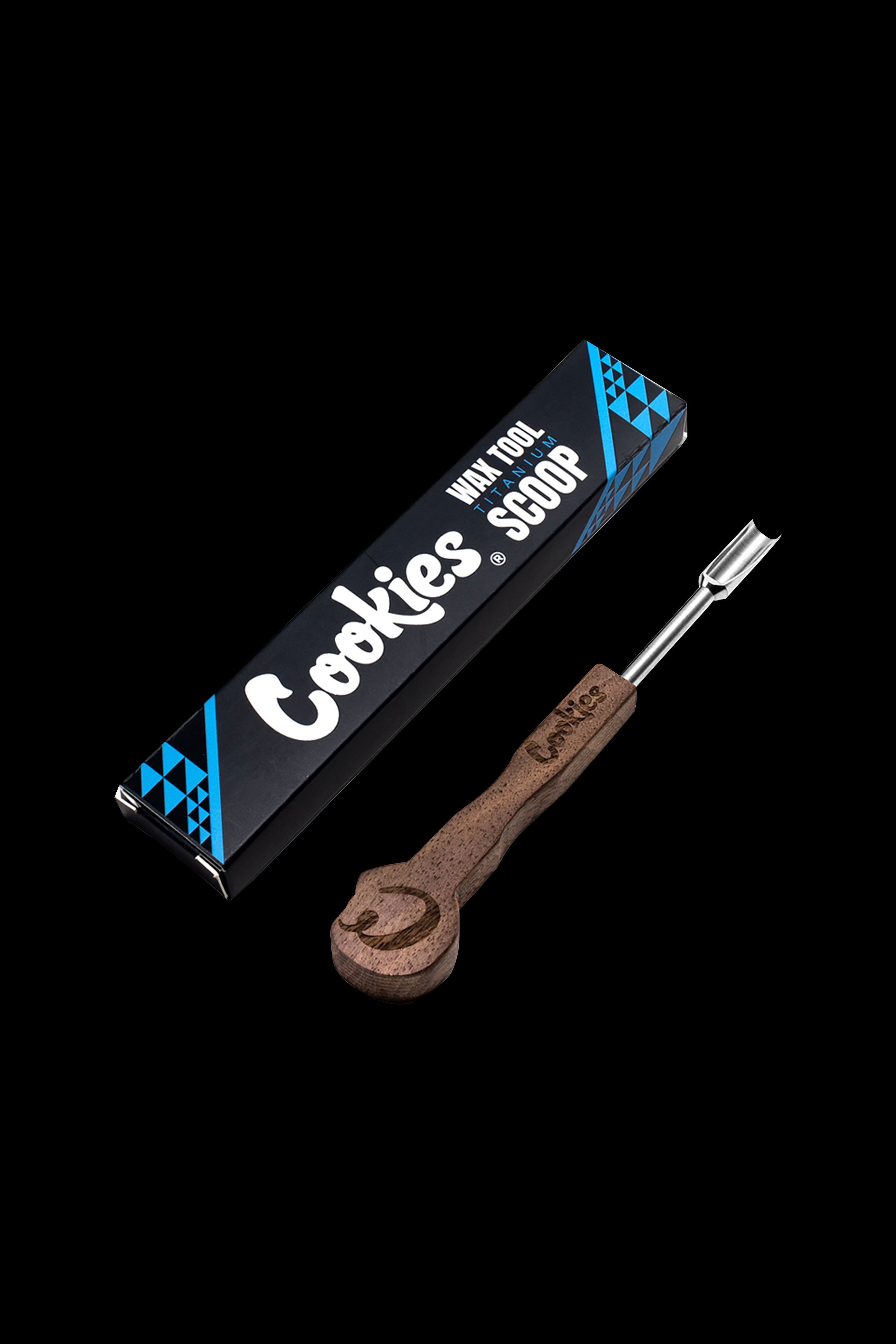 Cookies brand titanium wax scoop and dab tool against a black background.