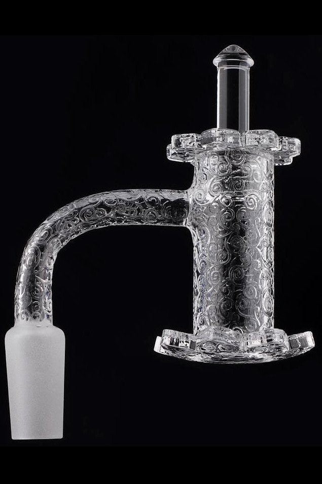 Ornate glass cannabis oil rig attachment.