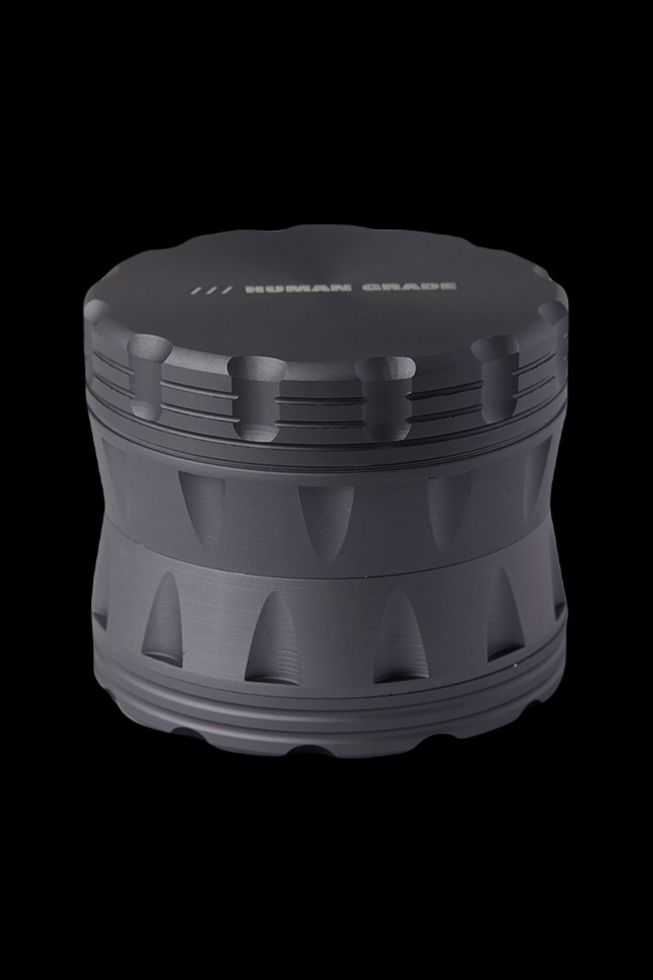 Black four-piece metal cannabis grinder.