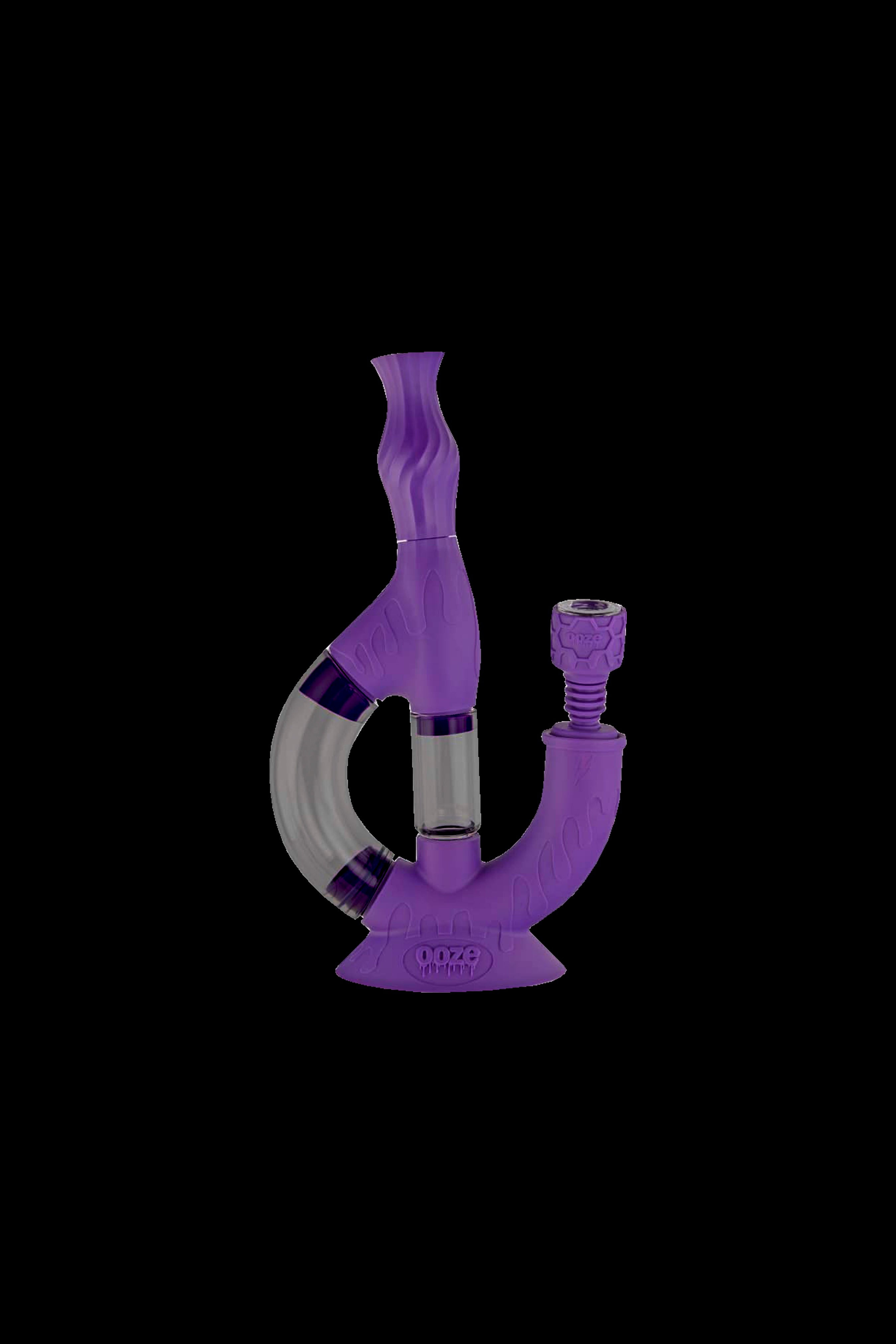Purple glass water pipe (rig) with intricate design.