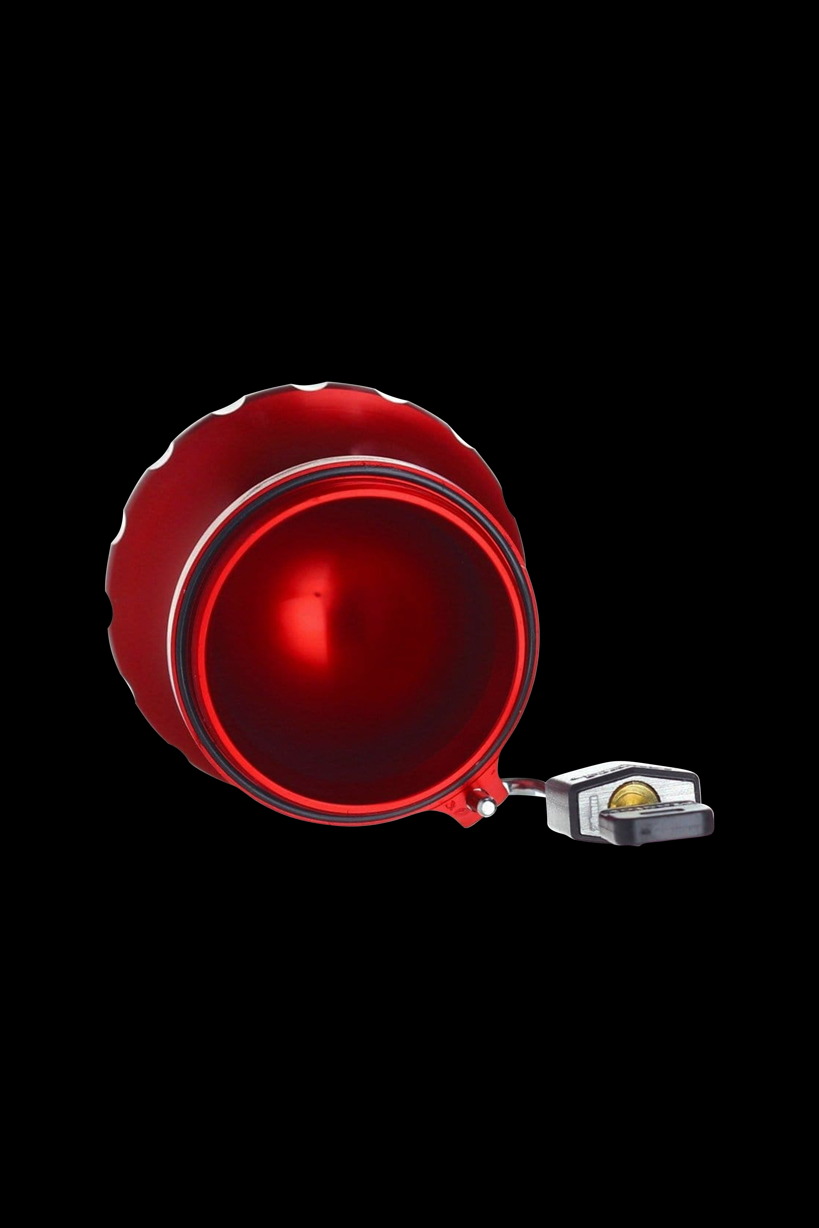 Red glass bubbler with a detachable mouthpiece, isolated on a black background.