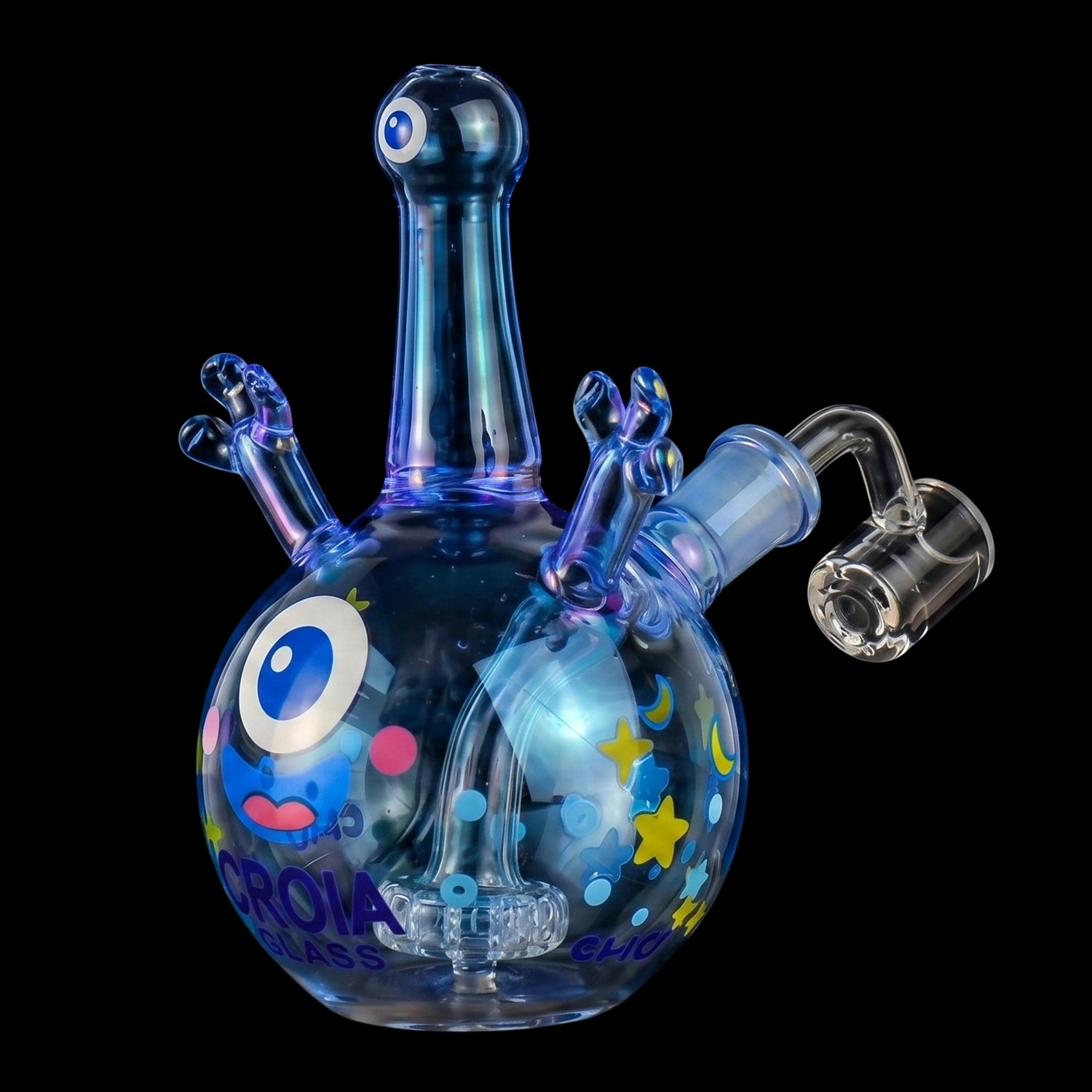 Close-up front view of the Croia Glass Cyclops Monster Mini Dab Rig with Showerhead Perc showing its iridescent blue glass cyclops head, stubby arms, and colorful star-and-eye decals against a black background
