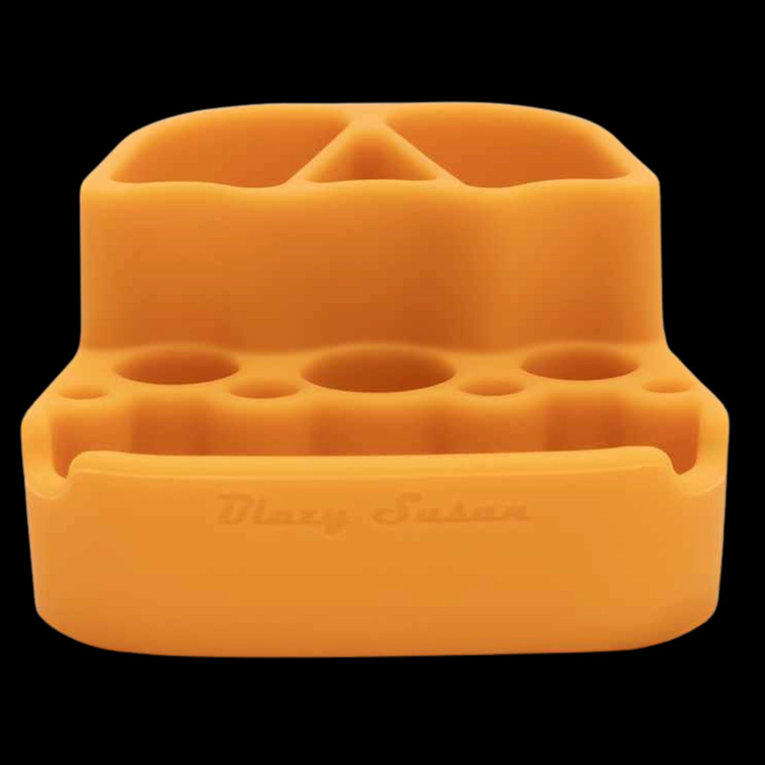 Close-up front view of the green Blazy Susan Dab Station showing its soft-edged silicone compartments and round tool slots against a black background.