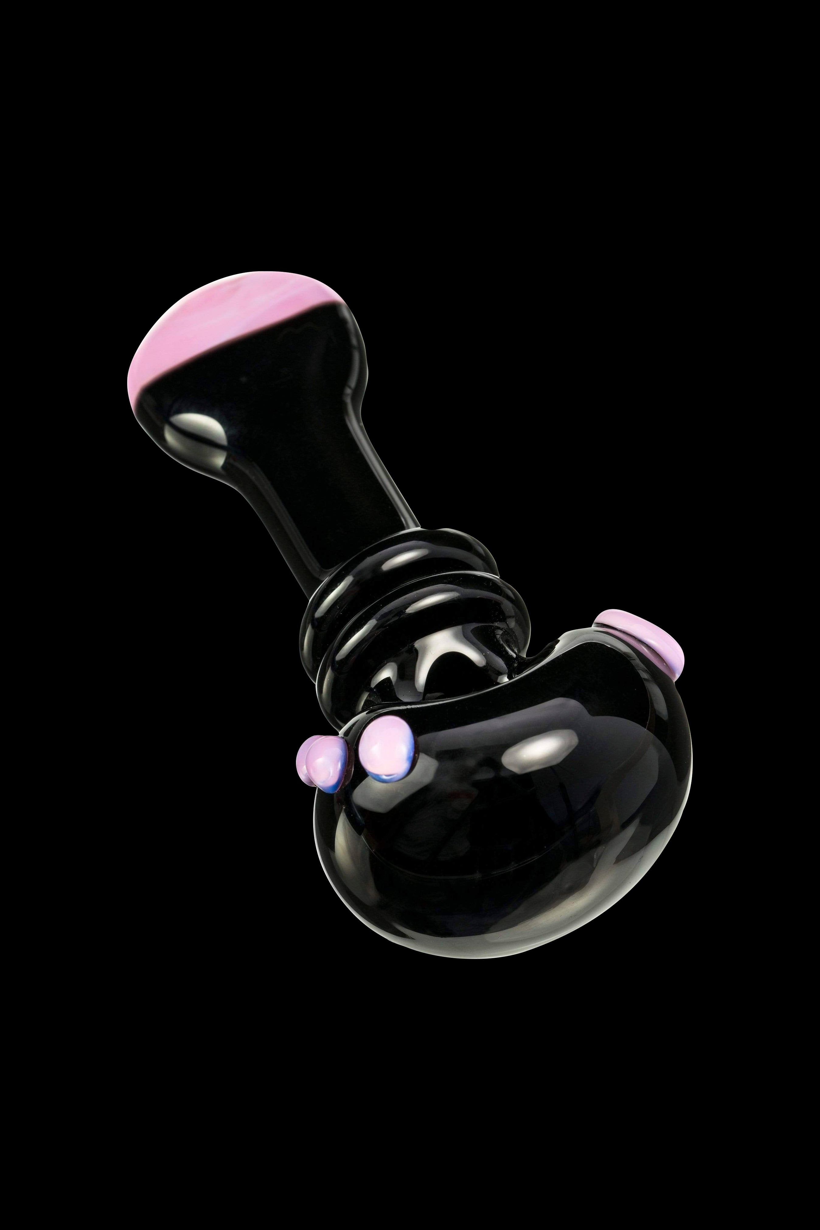 Glossy black glass oil rig with iridescent pink accents, floating against a black background.