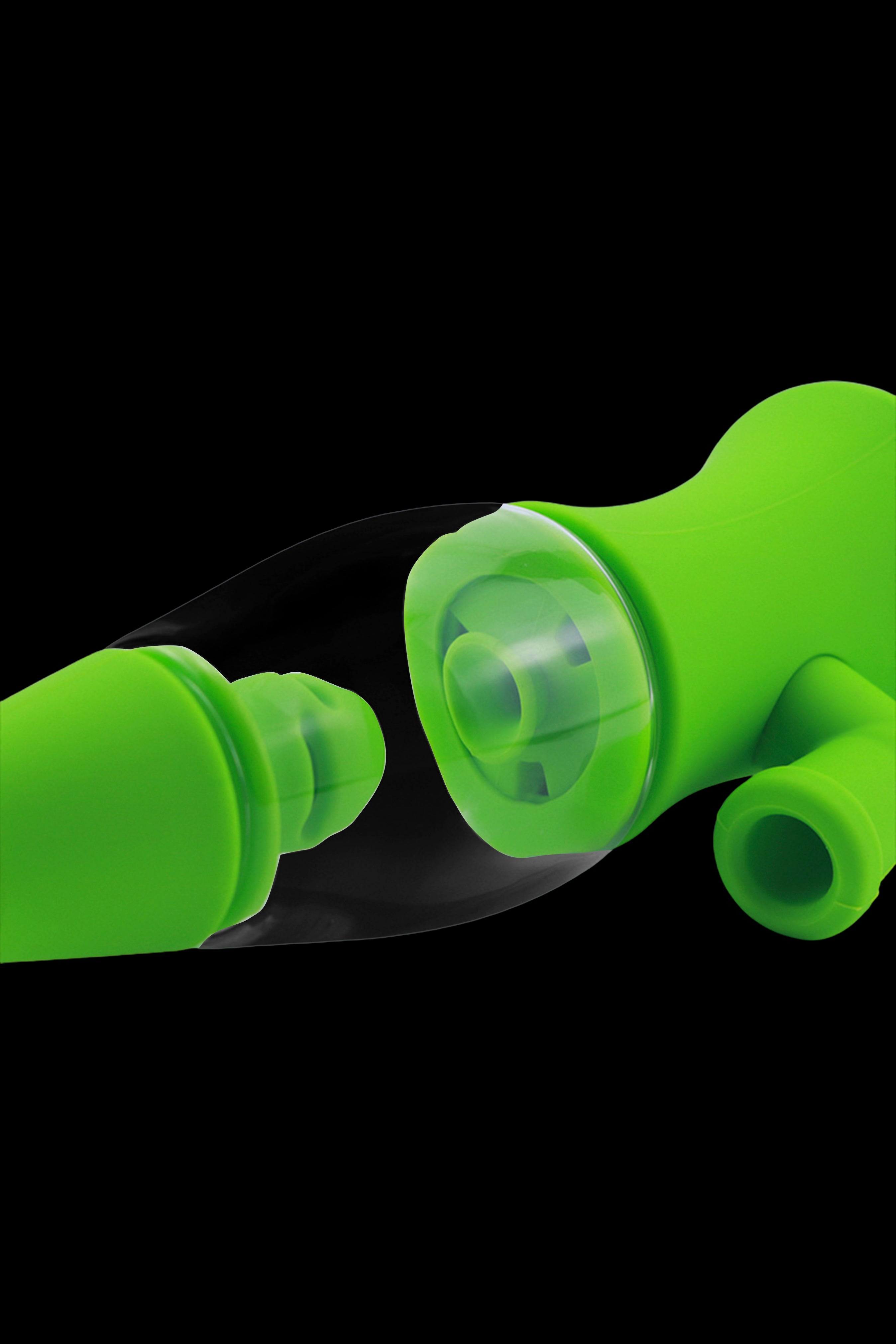 Bright green silicone tips for cannabis vaporizers or pens, displayed against a black background.