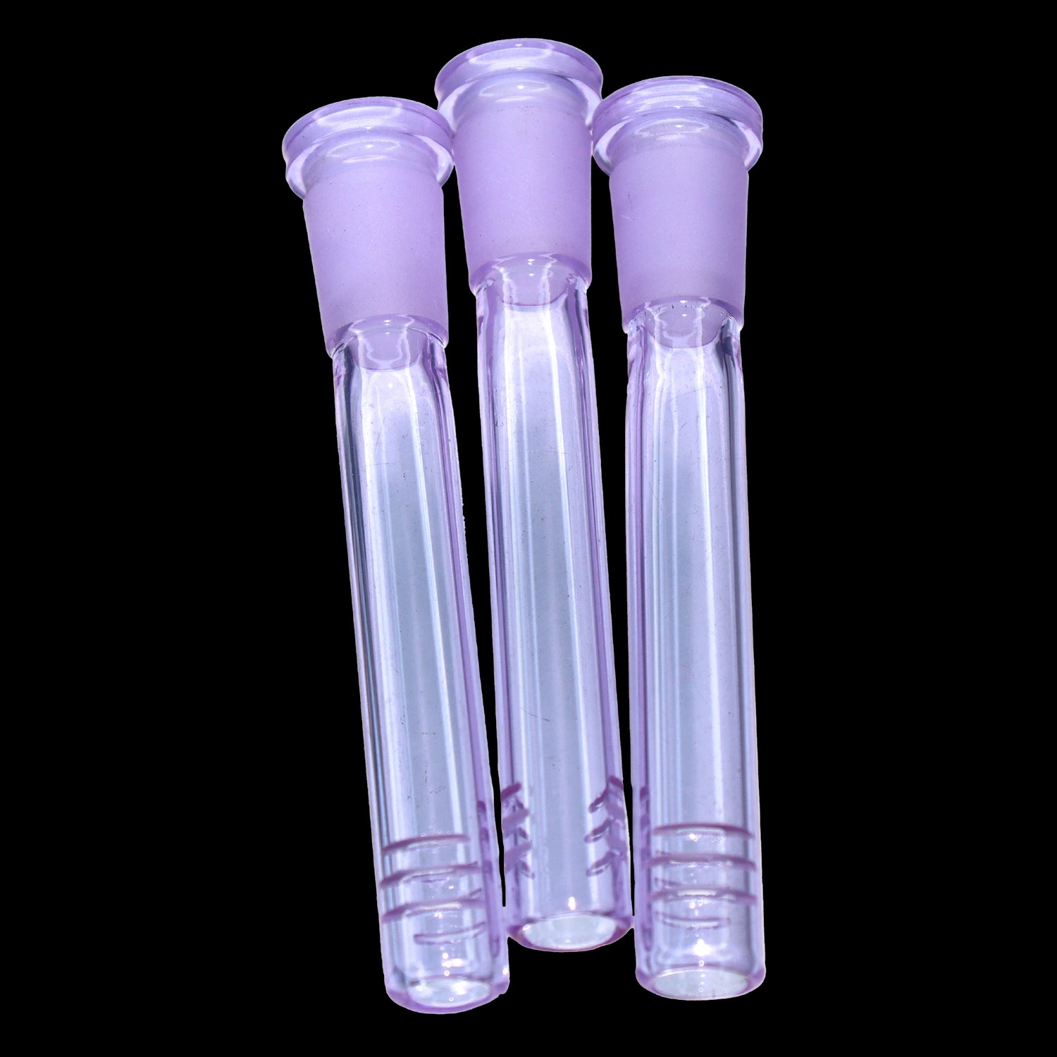 Close-up front view of three purple Smoke Cartel Color Diffused Downstem - 3.5 in. tubes against a black background, showing frosted ground joints and clear hollow stems.