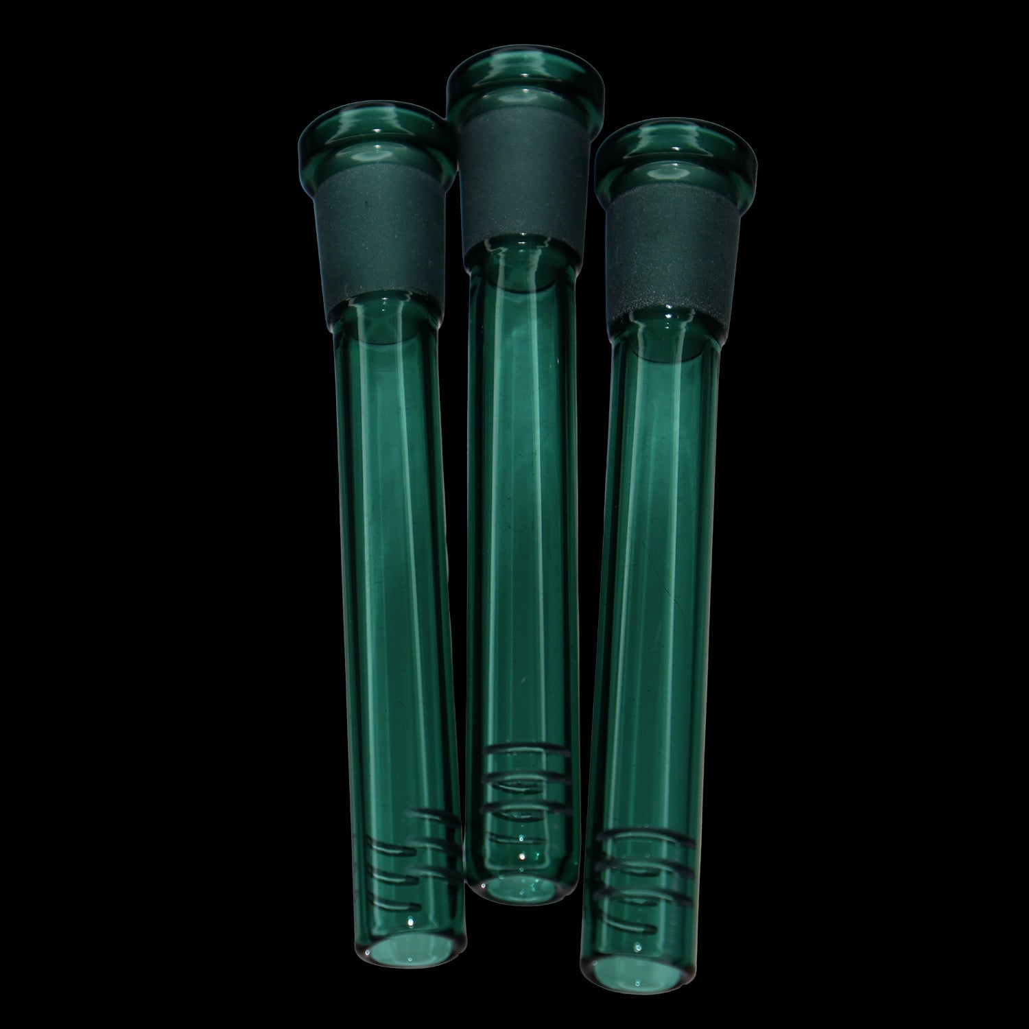 Close-up front view of three teal Smoke Cartel Color Diffused Downstem - 3.5 in. tubes against a black background, showing frosted joints and smooth glass shafts.