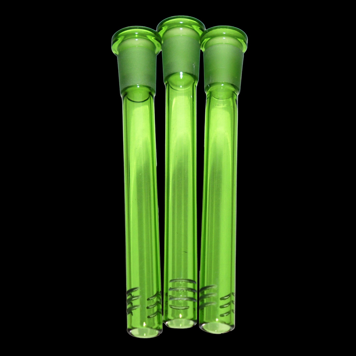 Close-up front view of three green Smoke Cartel Color Diffused Downstem - 4.5 in. tubes standing vertically against a black background.